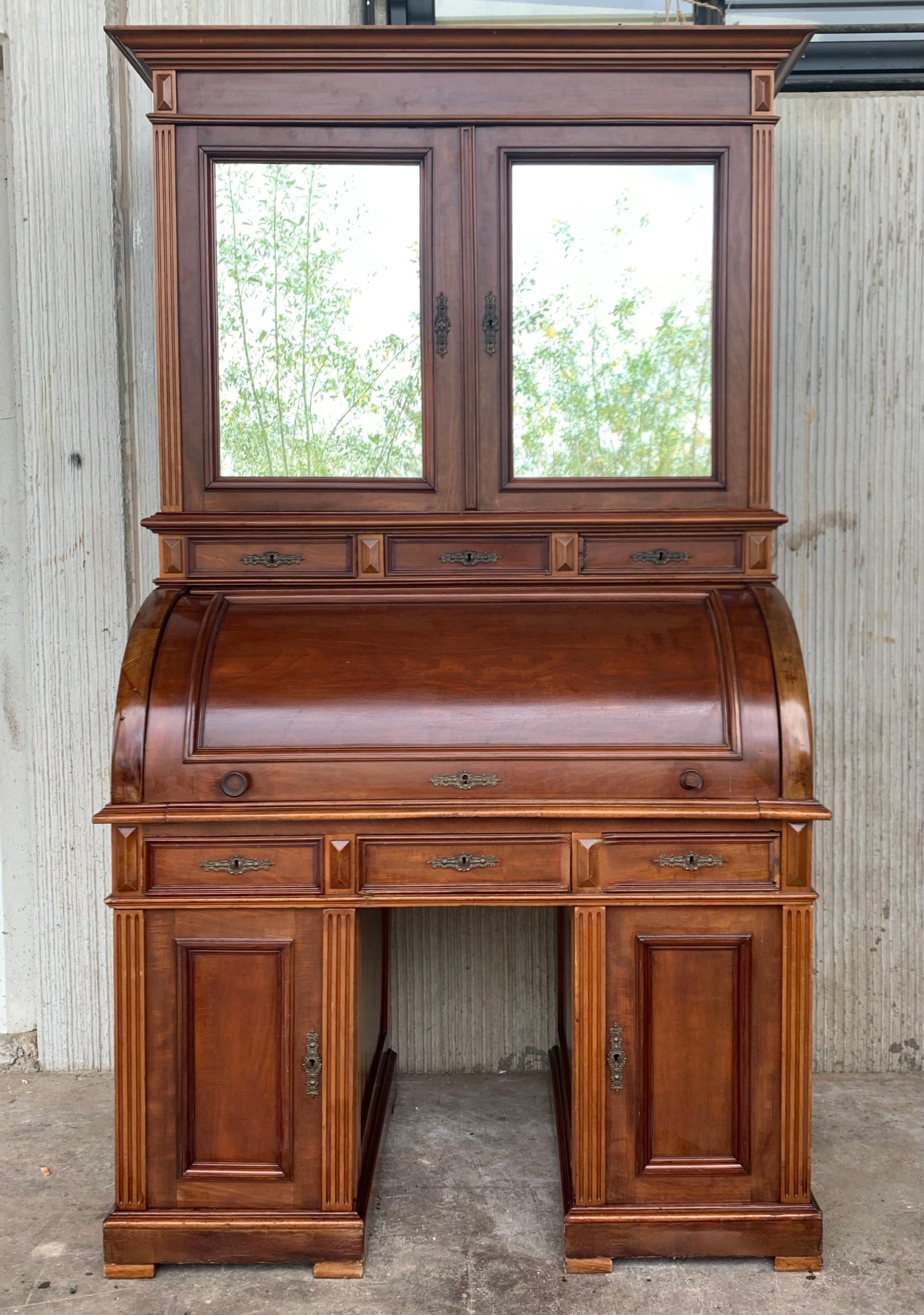 A very fine Empire secretary in West Indies mahogany, also known as Cuban mahogany, considered to be among the finest mahoganies because of its beautiful grain and color, Denmark, circa 1820.

Cylinder top opens to a pull-out desk which offers an