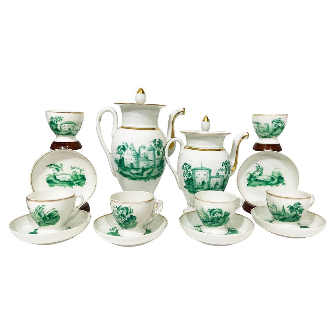 19th Century Empire Old Paris porcelain tea and coffee set

An early 19th Century Old Paris porcelain coffee, tea set with green painted French country scenes and gold paint. The gold paint shows some age wear
The set consists of a coffee and a tea