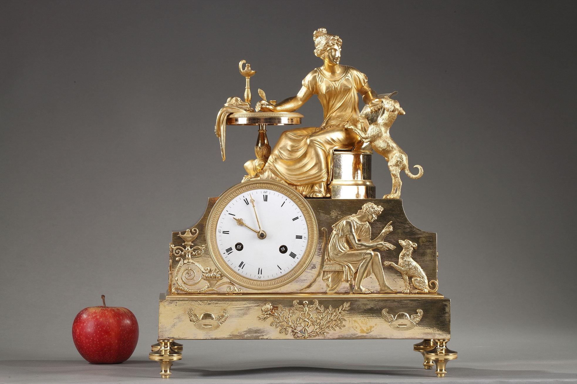 Early 19th century Empire clock crafted of gilt bronze, or ormolu, featuring an allegorical scene with a woman sitting at her work table playing with her dog, symbol of loyalty. The group is set above a raised case containing the dial. On one side
