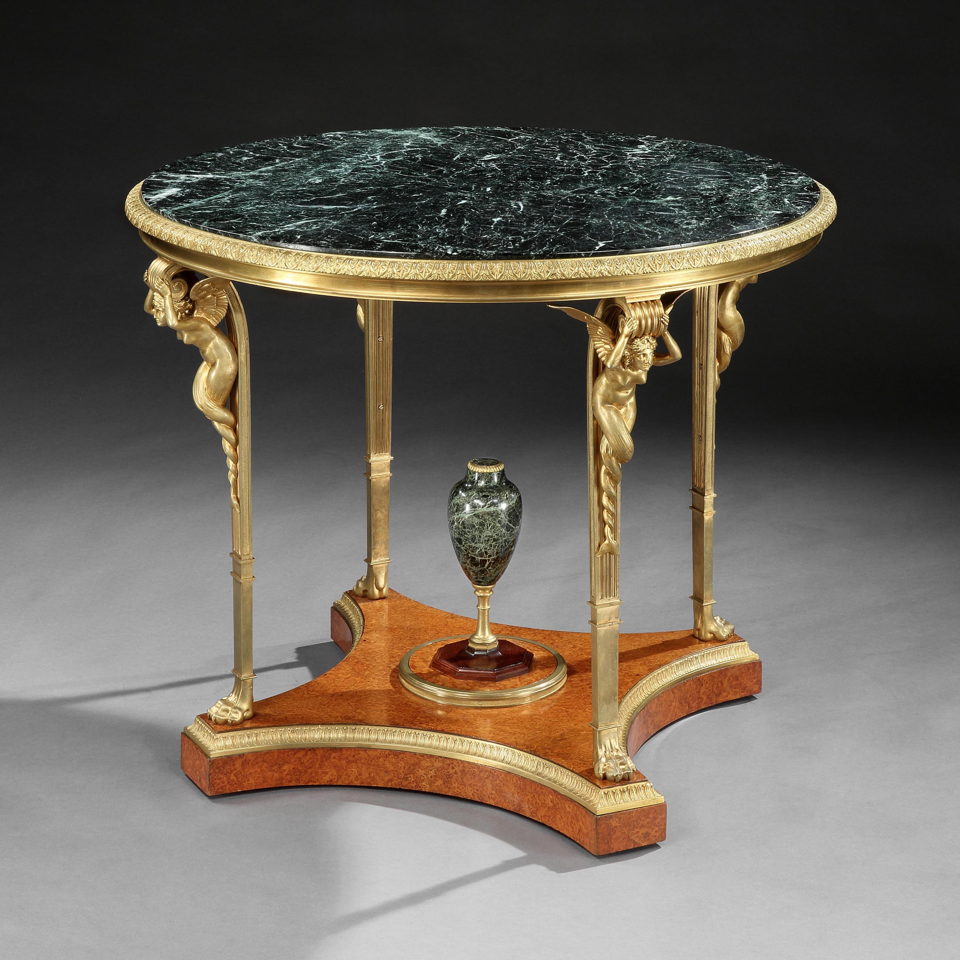 An Exceptional Gueridon table
Attributed to Maison Millet of Paris

After the original delivered to Fontainebleau
Attributed to Adam Weisweiler (1746-1820)

Constructed from precious amboyna wood and finished with extensive ormolu architectural
