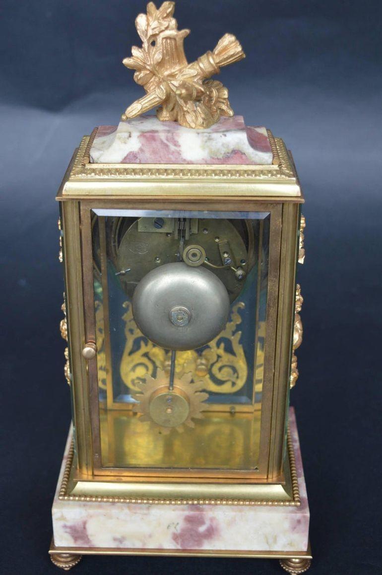Empire style clock with gilt bronze and marble. Stamped Medaille D'argent Vincenti clock, 1855.
Clock is in working condition.