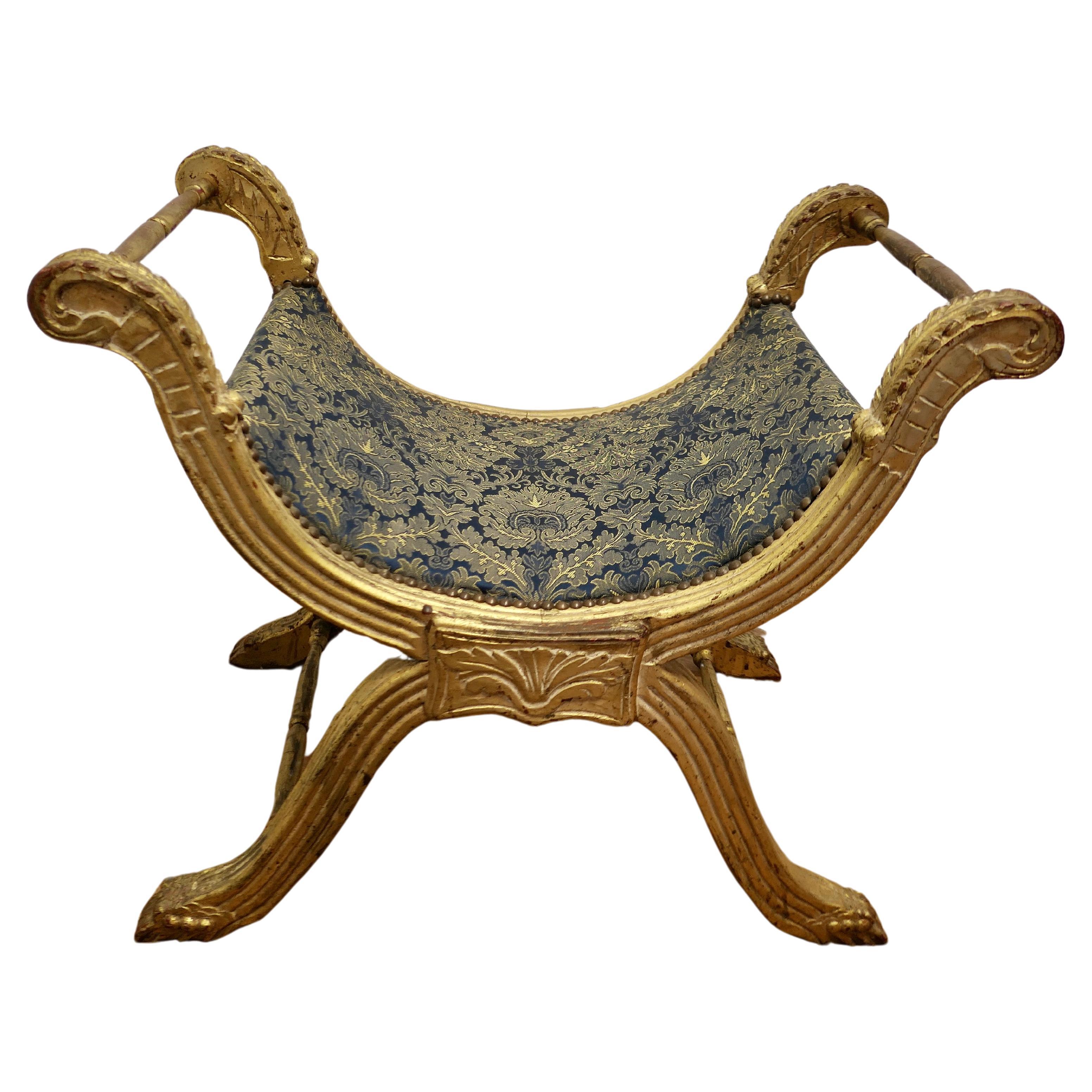 Tabouret de style Empire du 19ème siècle avec cadre en X doré   Une superbe pièce