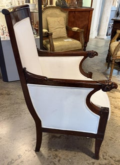 19th Century Empire Style Mahogany Bergere Chair with Ram’s Head Arms