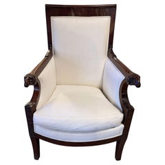 19th Century Empire Style Mahogany Bergere Chair with Ram’s Head Arms