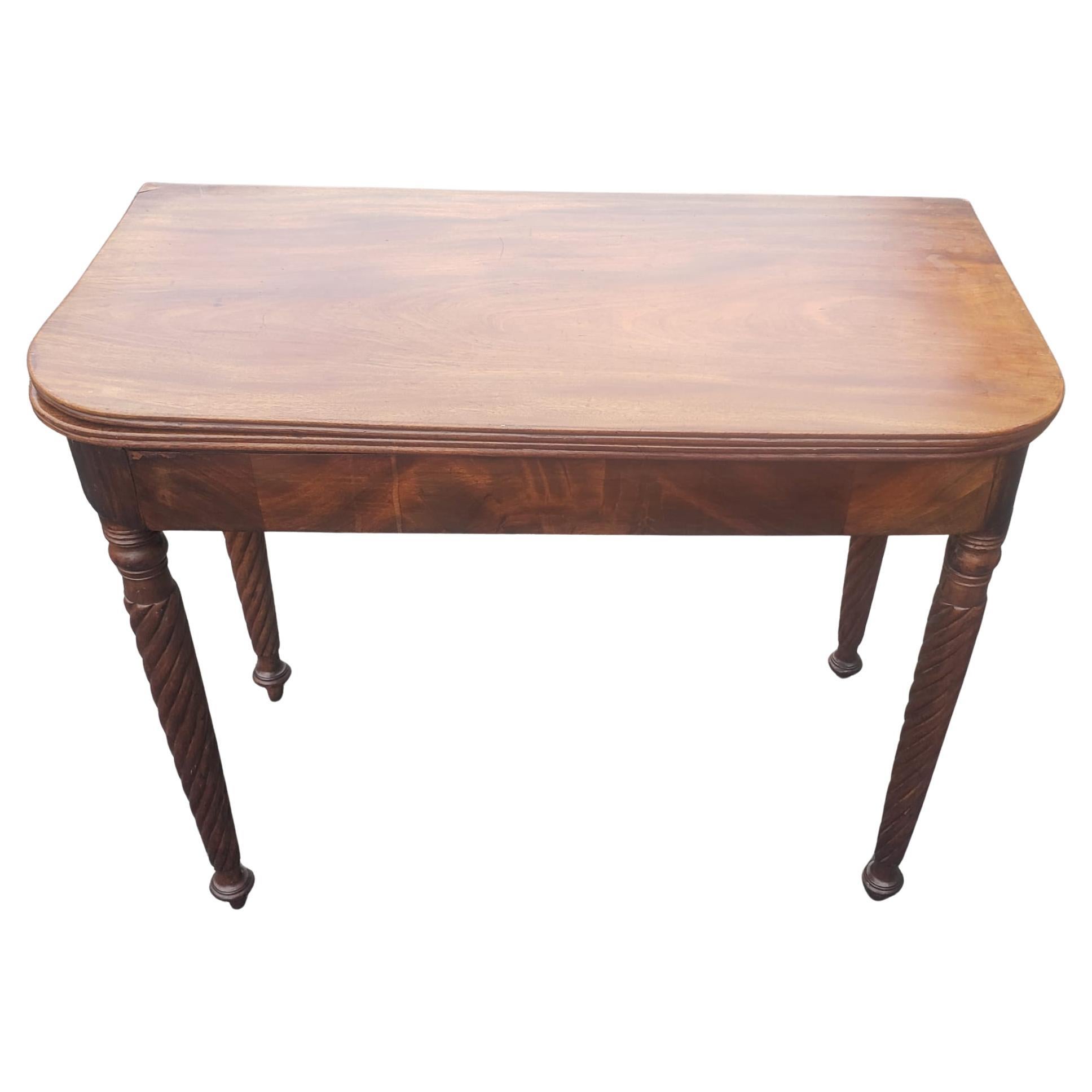 19th Century Empire Style Mahogany Fold-Top Game Table or Console Table with flame mahogany skirt. Measures 35.75
