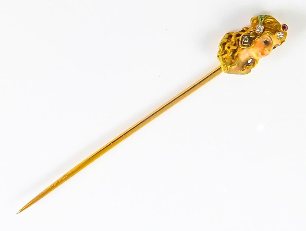 The present piece is a beautiful example of a mid to late 19th century yellow gold Art Nouveau lapel Pin/Brooch which can also be worn as a brooch lapel or stick or hair pin. The detailed enameling is in excellent condition and carefully designed to