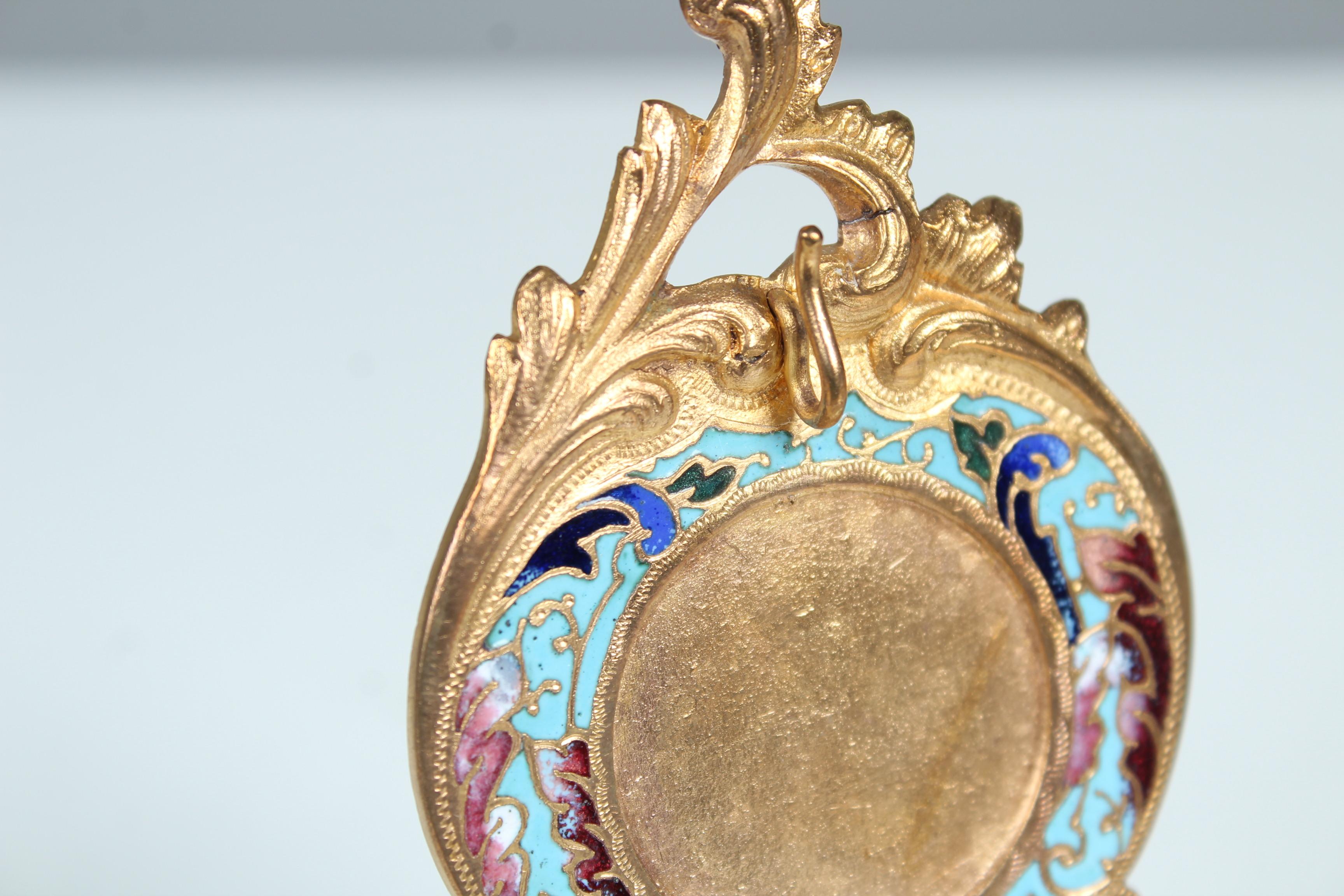 Beautiful pocket watch stand, or jewelry stand.
Brass with enameled ornaments.