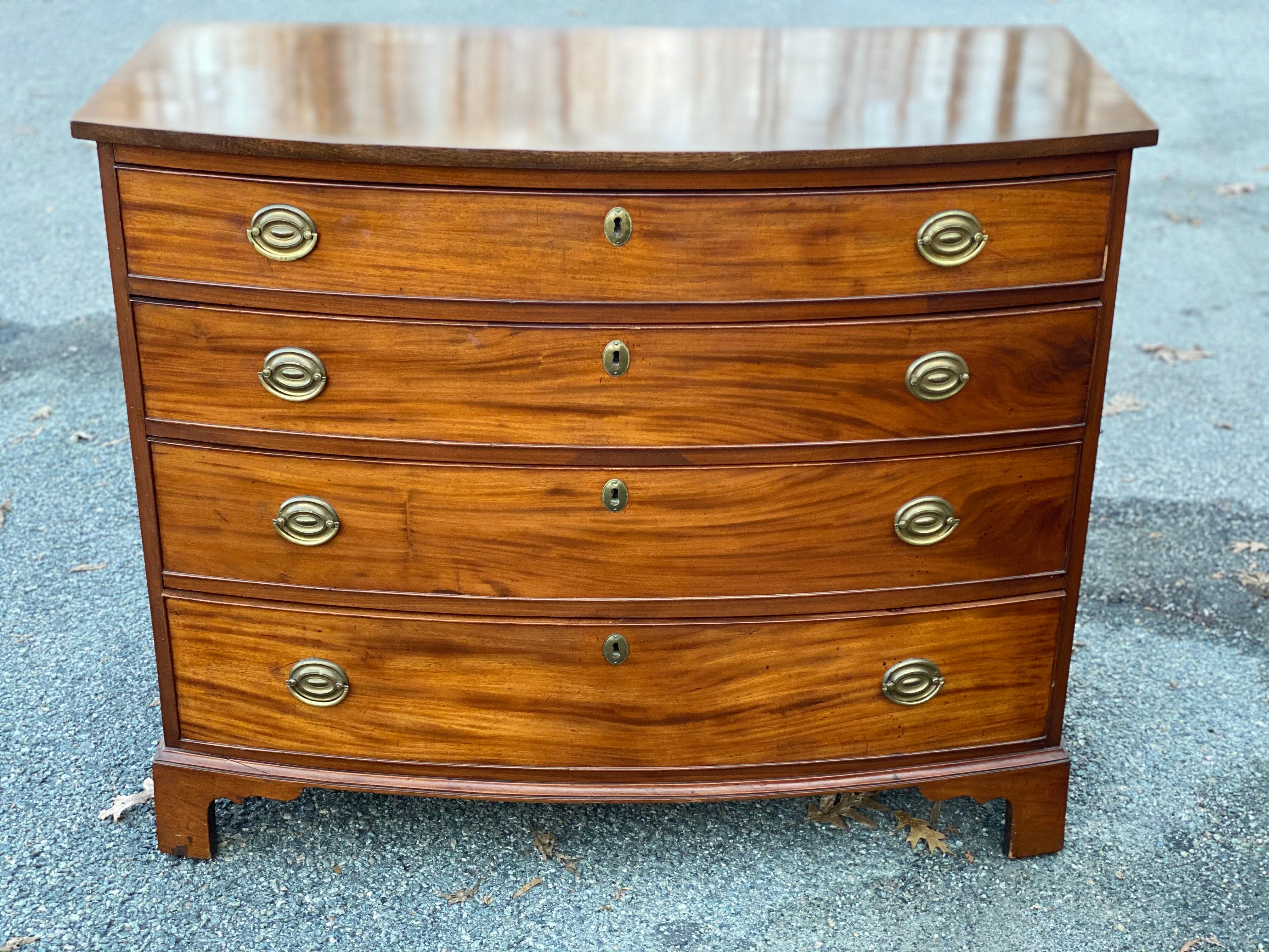 Very good 19th century English 4-drawer bowfront chest of drawers with figured mahogany on bracket feet. Very good color and patina.