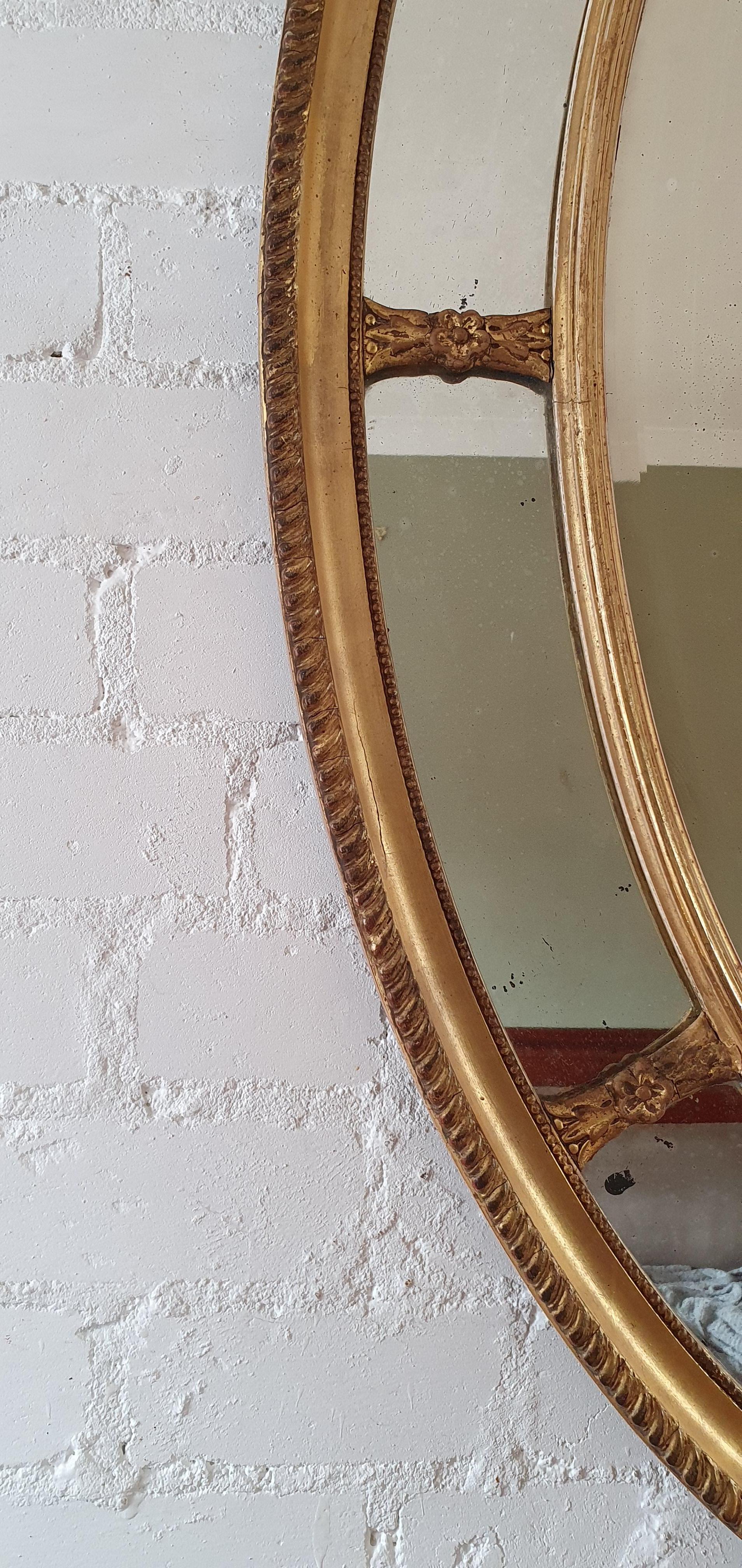 Gilt 19th century English Adam Style Oval Mirror For Sale