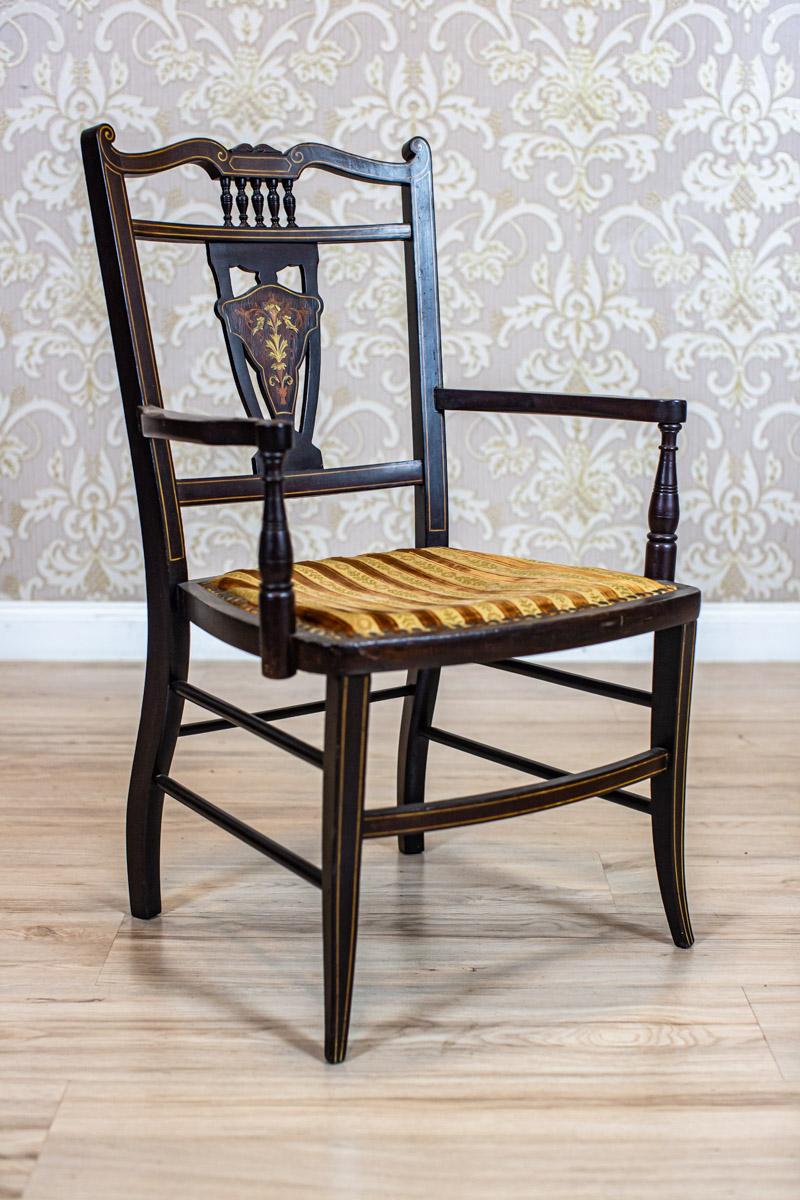 19th-Century English Upholstered Armchair with Decorative Backrest

We present you an armchair from the late 19th century of a delicate form.
The backrest with openwork cuts is highly encrusted.
Moreover, the wavily shaped rails turn smoothly into