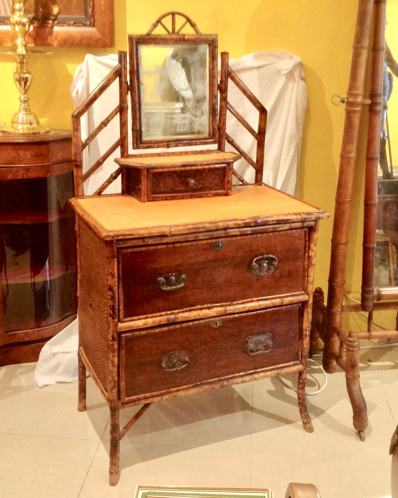A charming dresser of small proportions with good detail around the mirror.