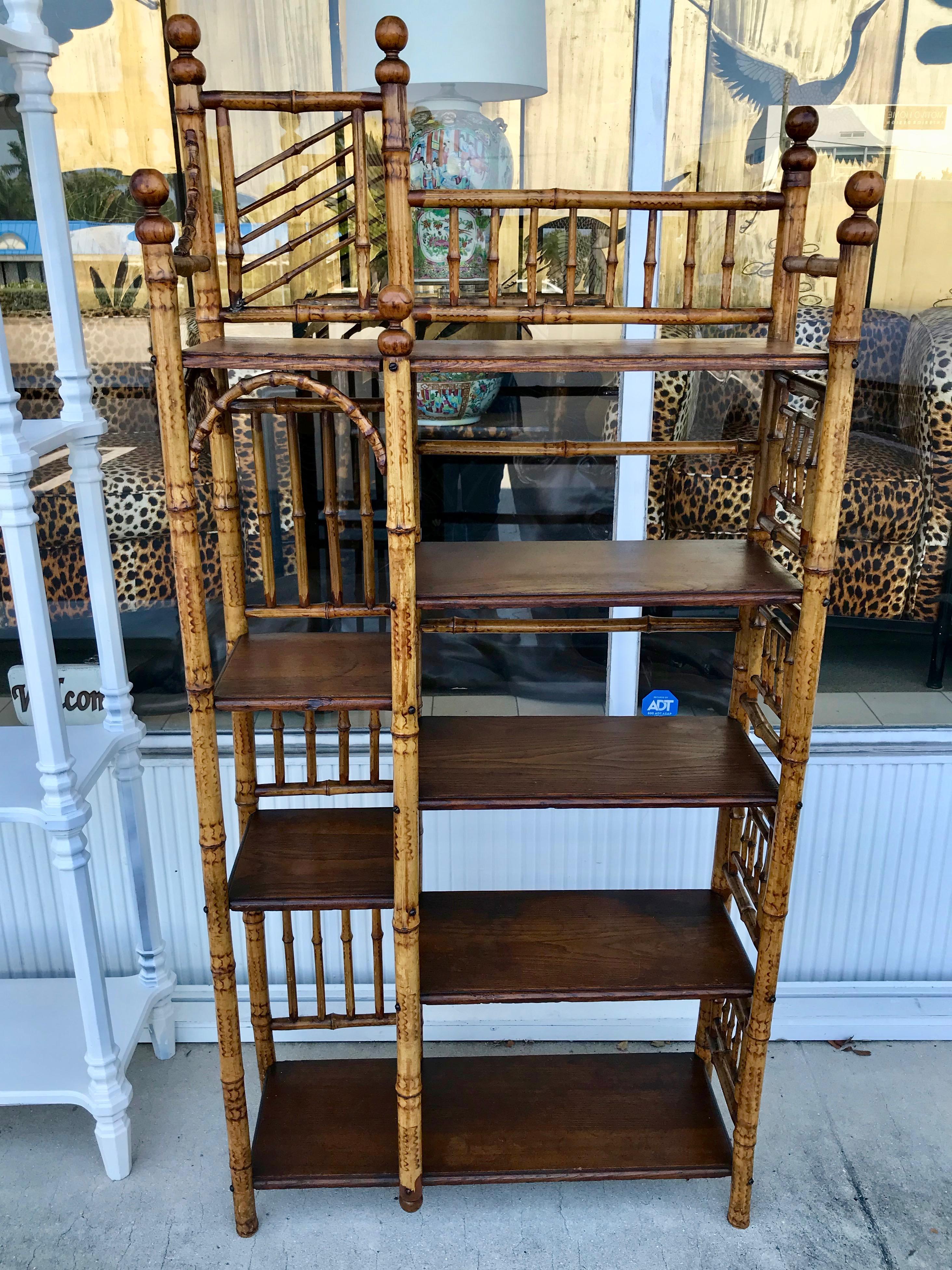 Superior quality and very nice condition. An elaborate yet sturdy
and impressively scaled display piece or books stand with oak shelves.
A rare and beautifully detailed etagere/ bookcase.