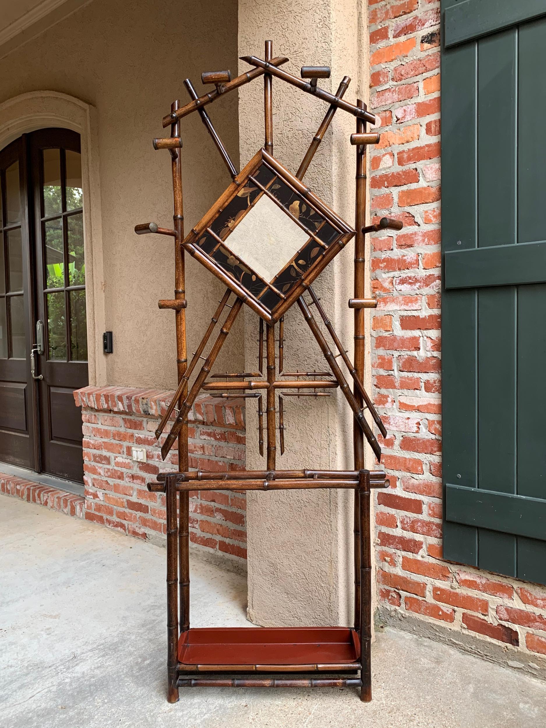 ~Direct from England~
~Majestic 7 ft. tall antique English bamboo hall tree, umbrella stand with beautiful features!~
~Center beveled mirror has a wide frame of bird themed lacquer panels~
~Fabulous bamboo details, with original bamboo ‘coat/hat