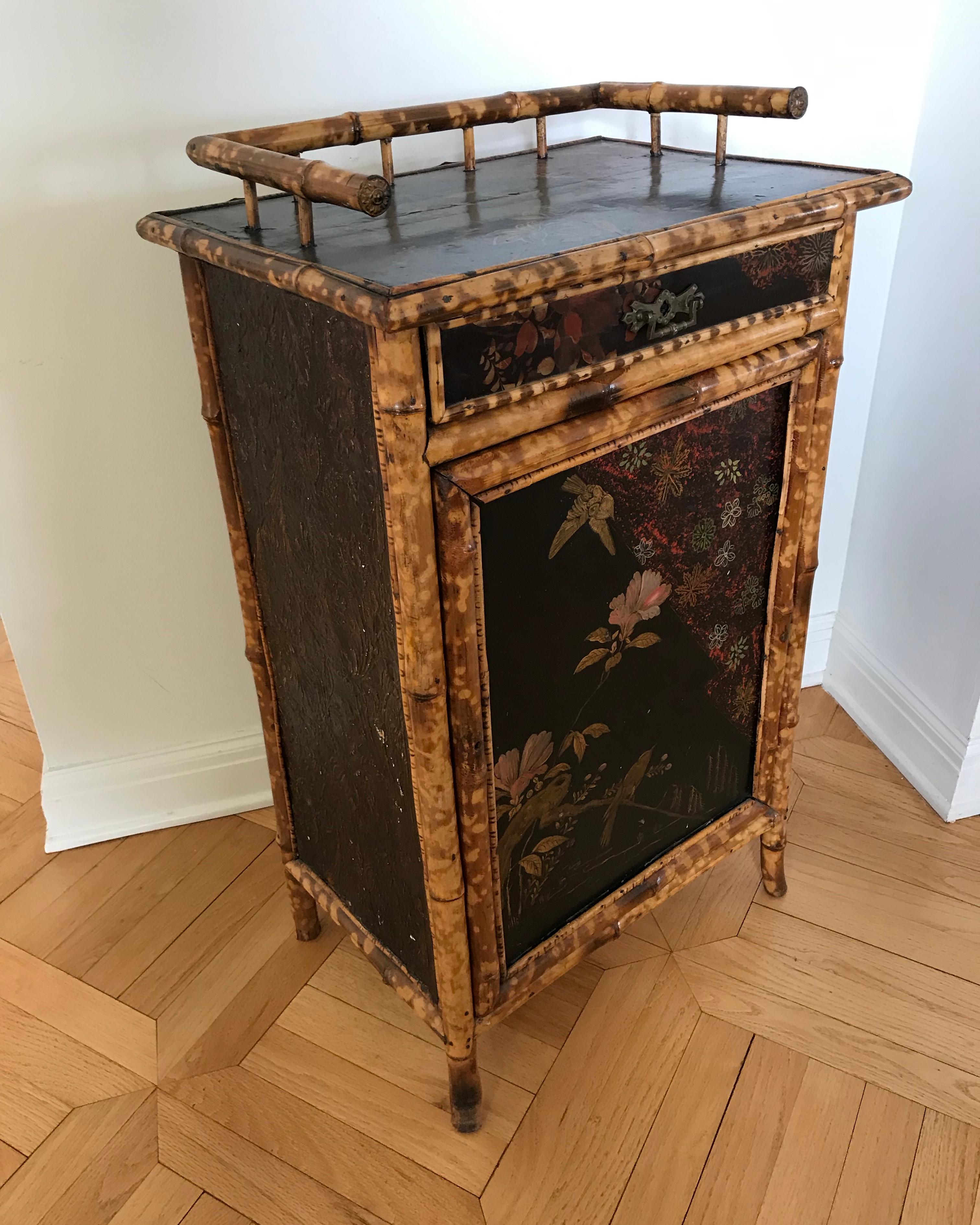 Beautifully fashioned and decorated with lacquered hand painted panels featuring birds and florals. The piece is accented with a generously scaled gallery. (2.5