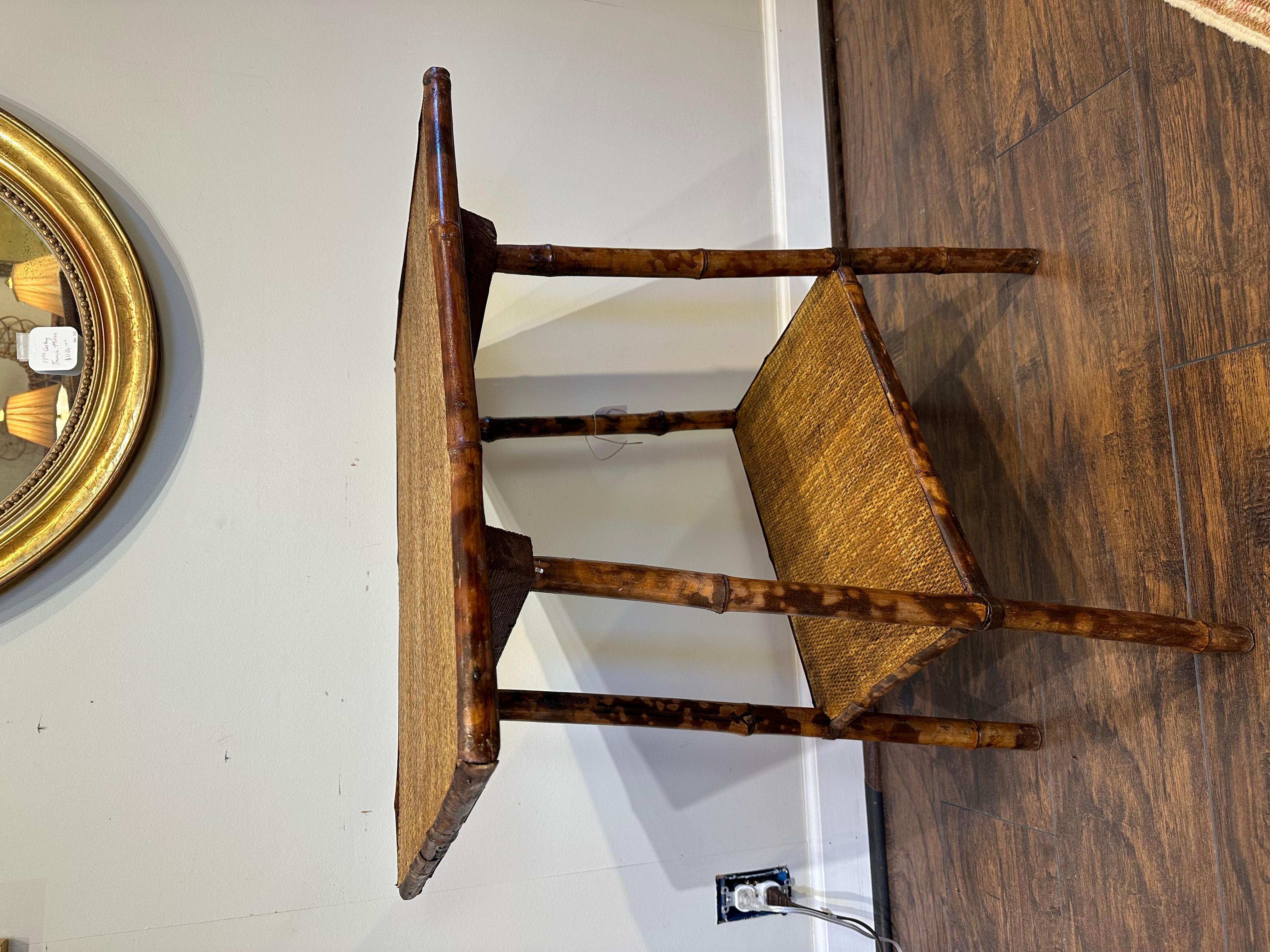 eautiful 19th Century English bamboo side table! There is lovely natural design and detail in the bamboo wood, and the colors and style make this a perfect transitional piece that would go well any room! 
