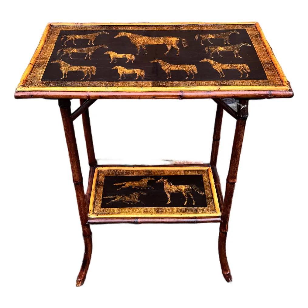 This 19th Century English Bamboo Side table features a delightful variety of equine decoupaged onto the top and lower shelf. This would make a sweet bedside, chair side or lamp or plant table, or anywhere you want to add an interesting display