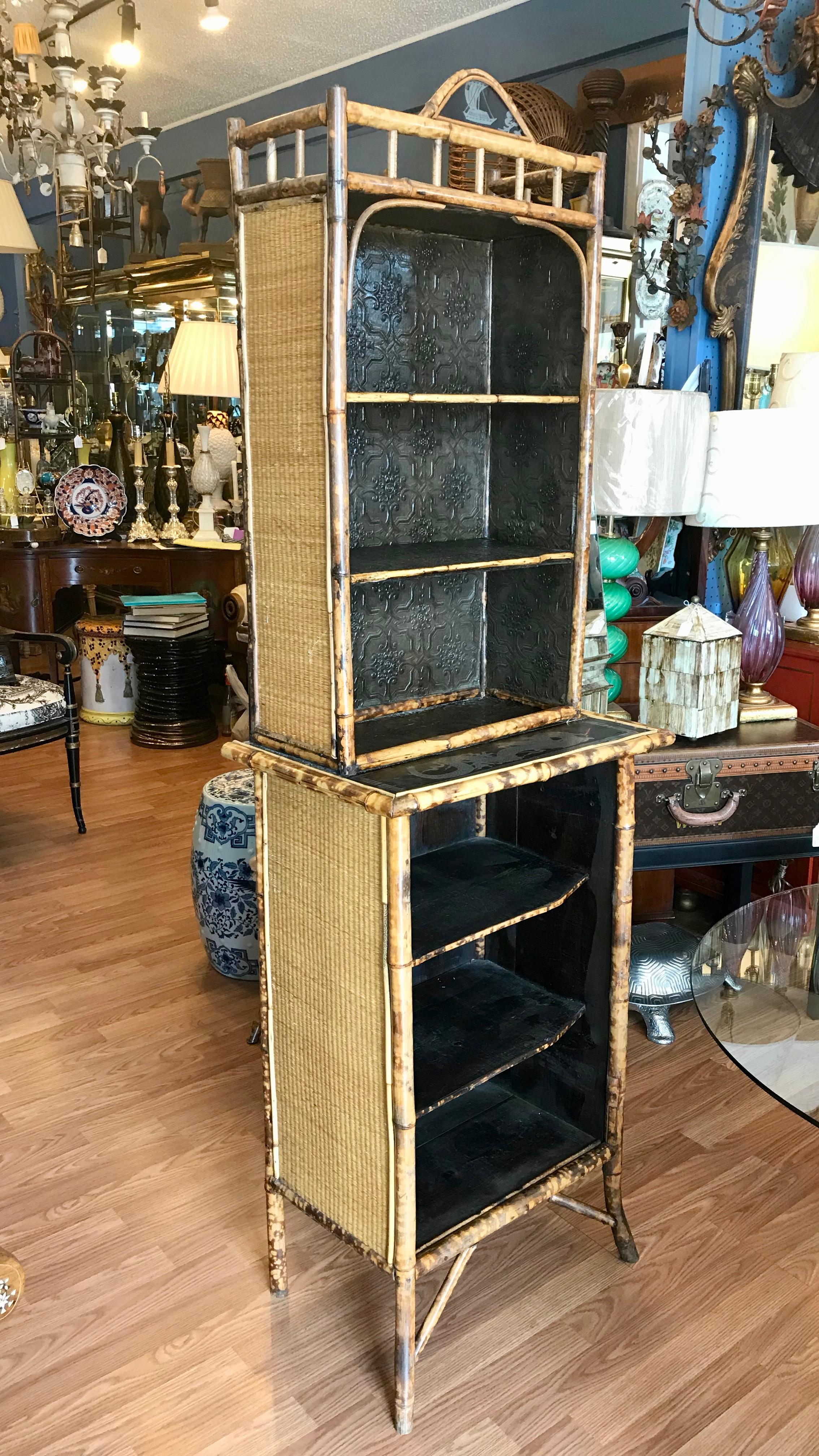 The bookcase is nicely scaled and is
designed with a step back top above
the lower cabinet. A lacquered panel
decorated with a figure of a dragon has
been inserted into the step back top
that rests above the lower cabinet-
unusual.