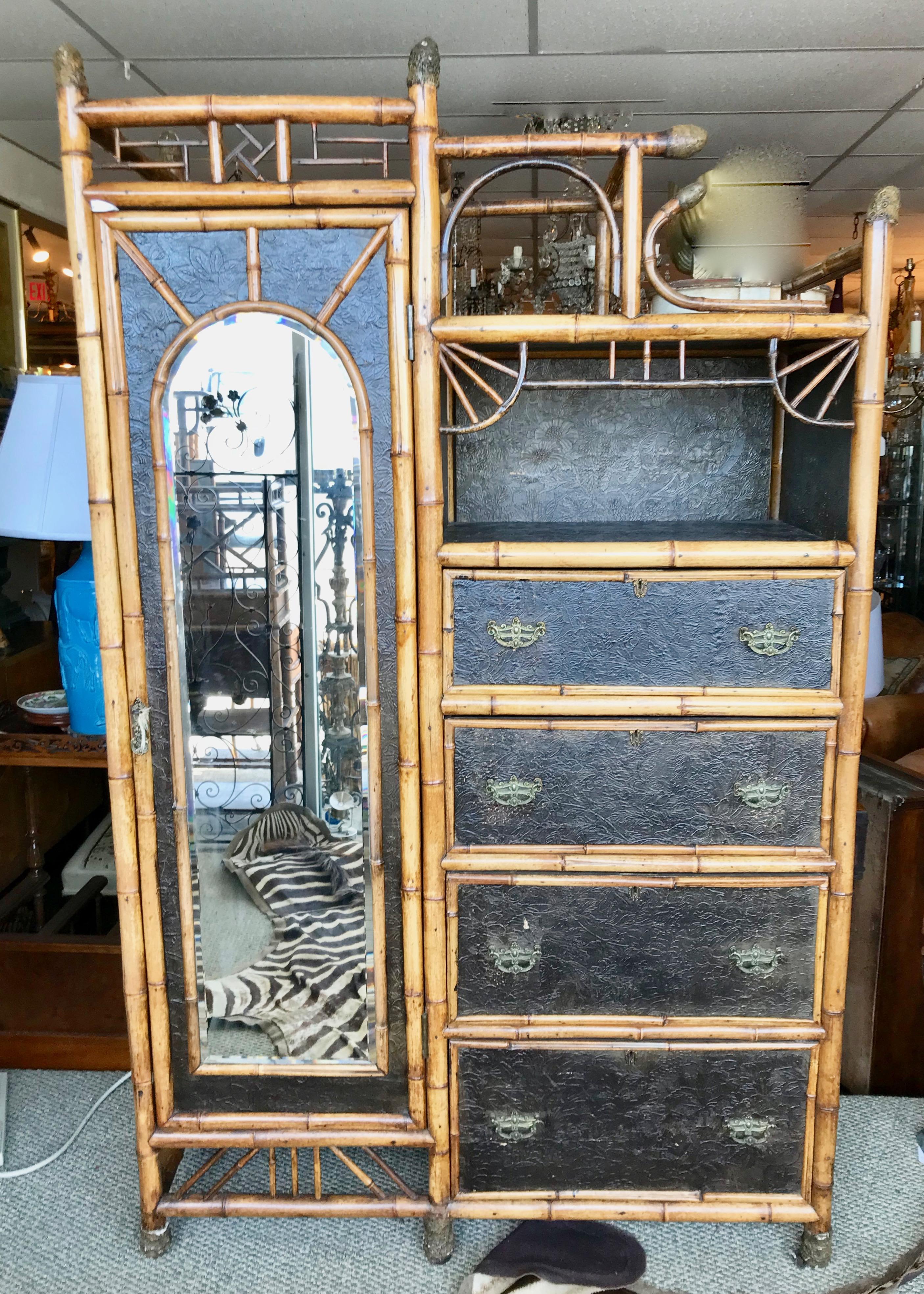 An exceptional rare design. An imposing and eye catching cabinet with
elaborate appointments, root accents and original beveled glass mirror.
A superb example.