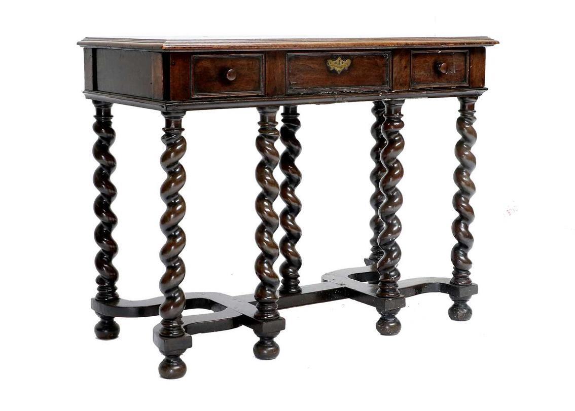 19th century English barley twist leg console.
Three drawers.
Two wooden knobs.
Brass escutcheon plate on center drawer.
English mahogany.
Recently refurbished.