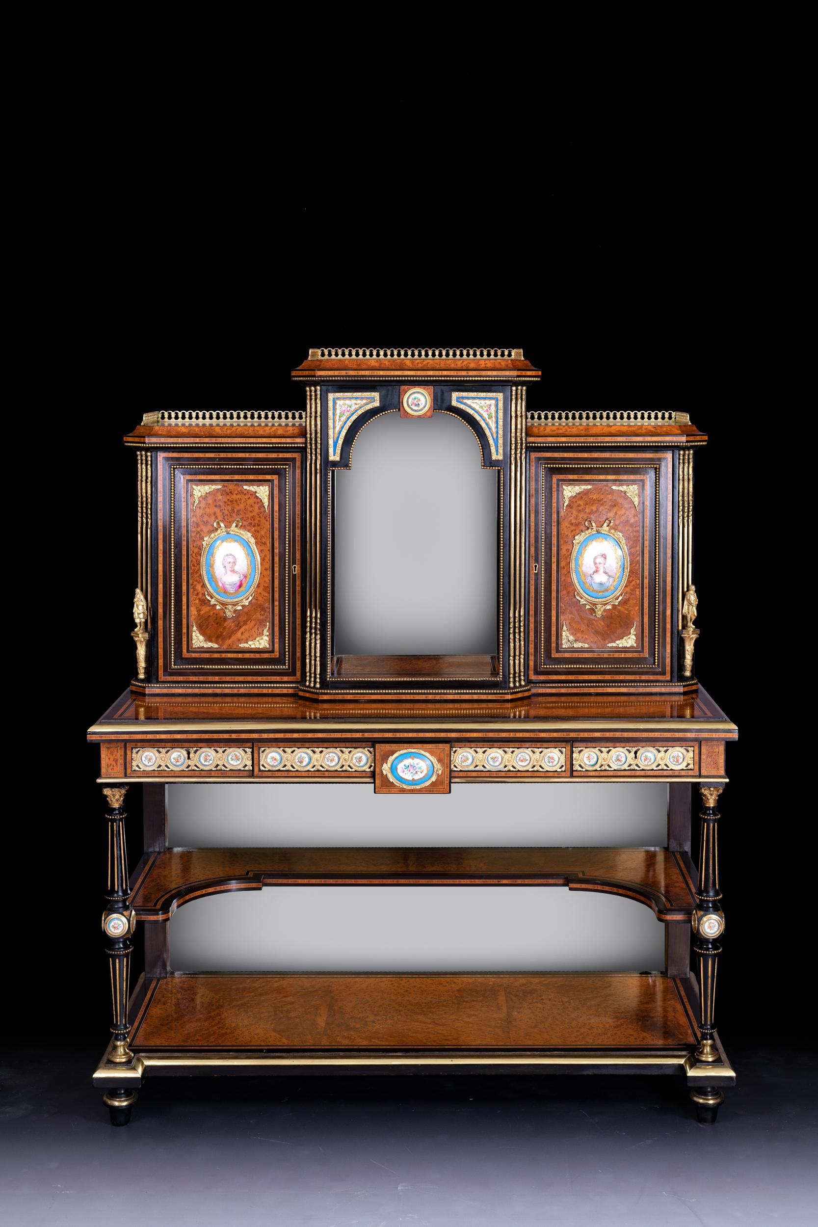 A very fine 19th century Burr walnut, ebonised , ormolu and porcelain Bonheur du jour, the superstructure with pierced brass galleries above an open compartment with mirrored interior flanked by cupboards with oval serves panels containing shelves