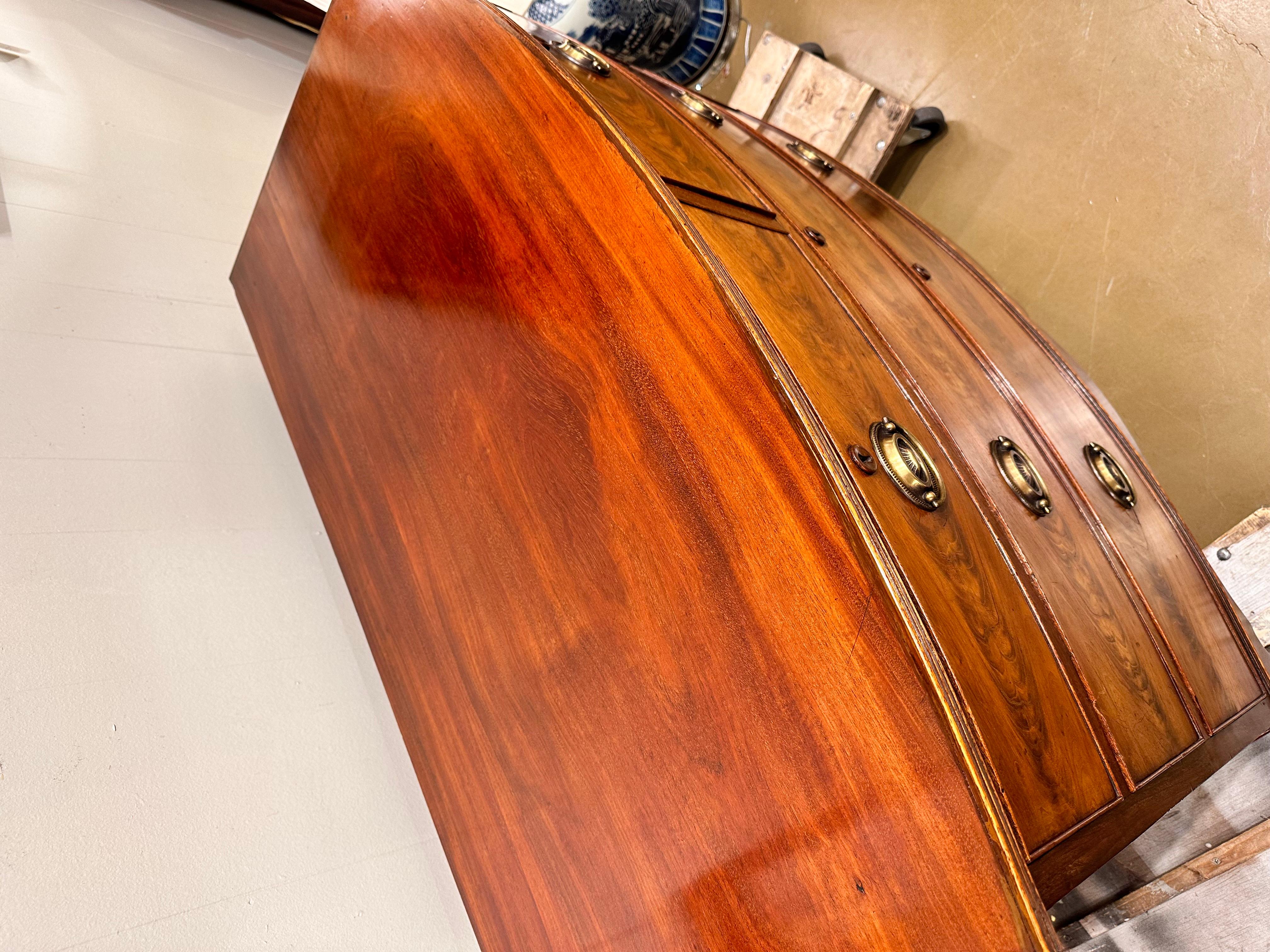 This is a beautiful 19th century English bow front chest. The condition is excellent with no repairs no perviously broken legs the drawers are in perfect condition and slide perfectly. Not to mention the color and the amazing French polish. This is