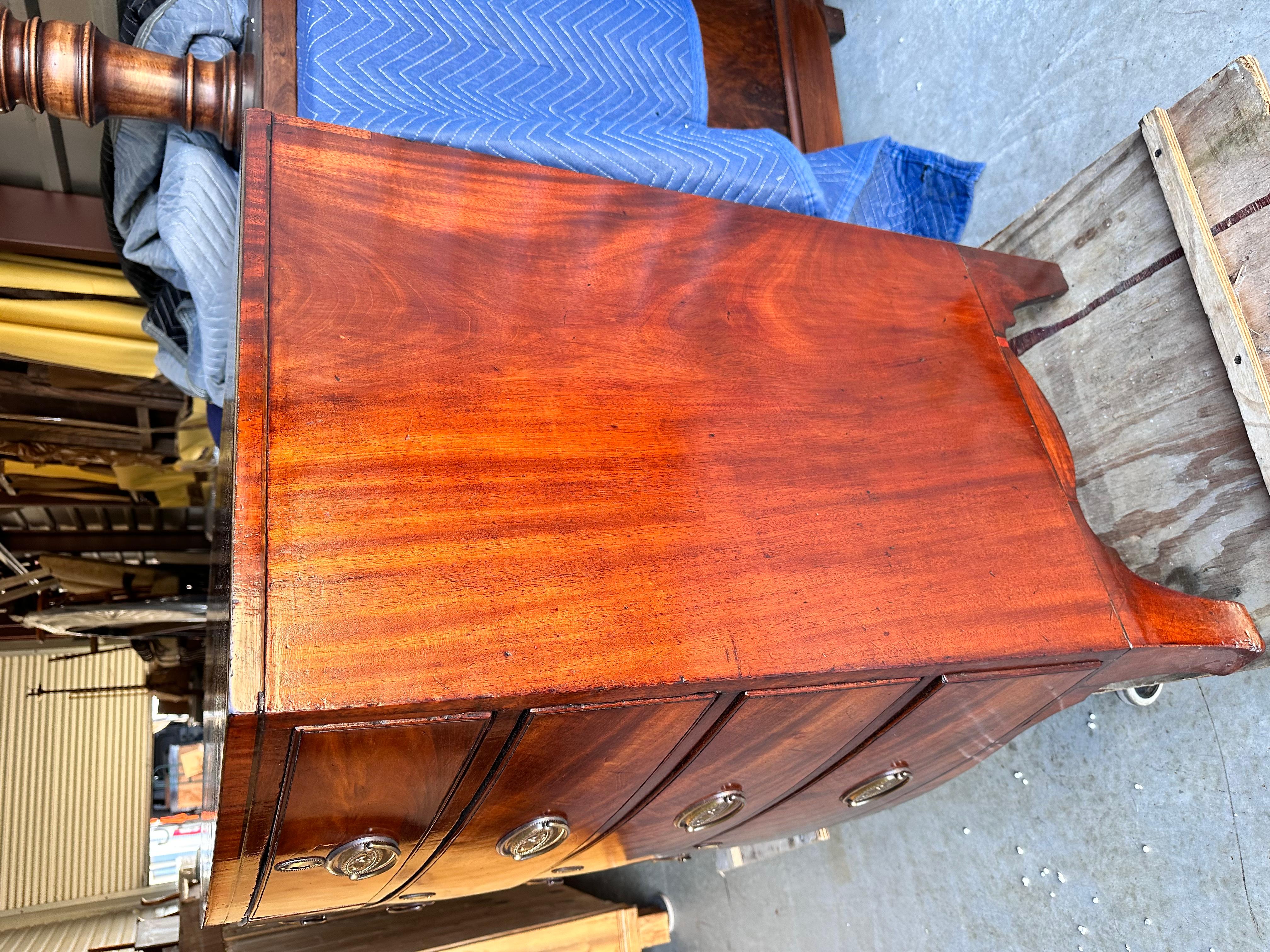 This is a stunning English bow front chest. It’s been beautifully French polished make the flamed mahogany really glow. Matched with exquisite brass pulls on drawers that slide perfectly.