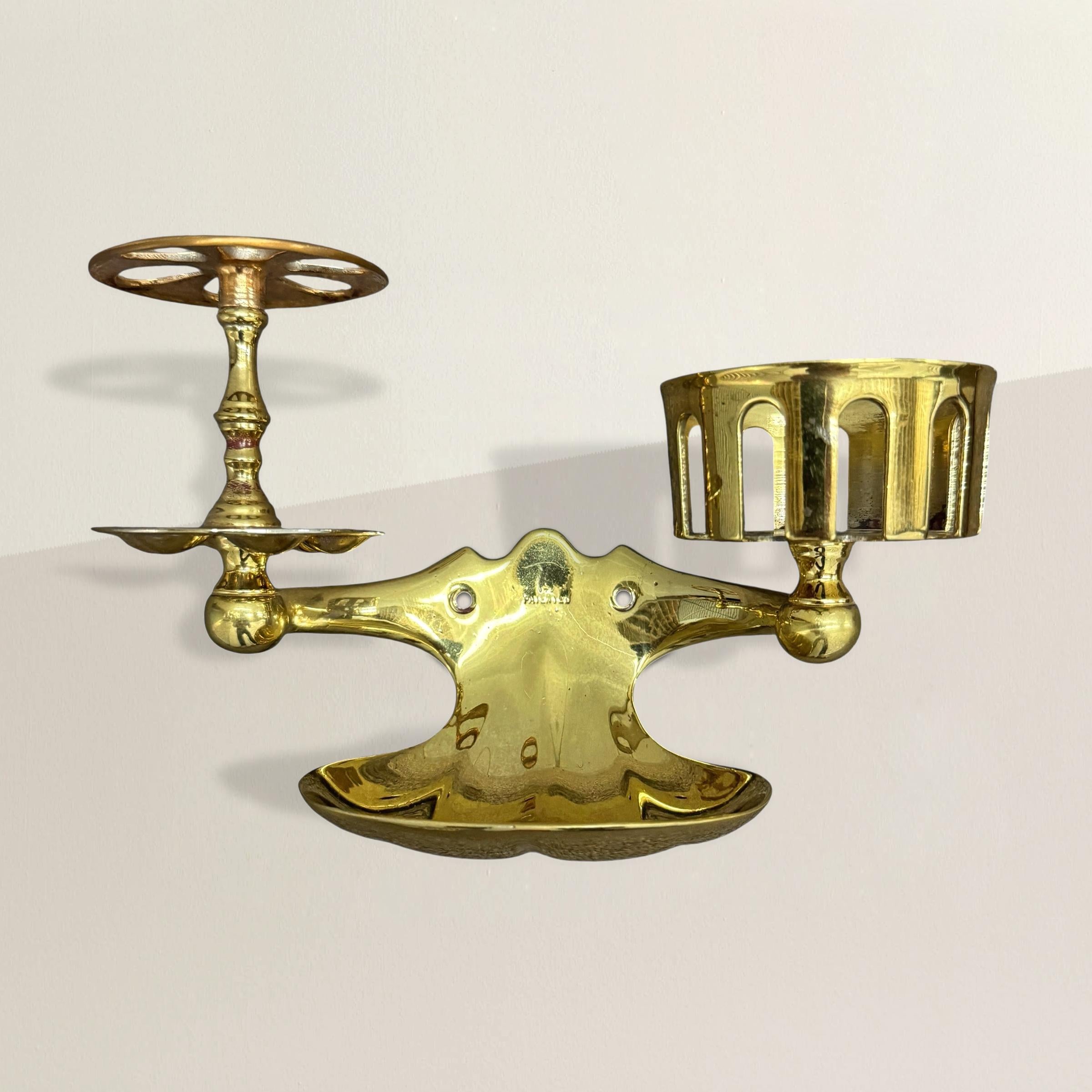 An everyday ritual, elevated. This late 19th-century English wall-mounted soap dish is cast in polished brass, its warm patina carrying the quiet glow of use and time. Practicality was the brief, but the execution borders on elegance: two additional
