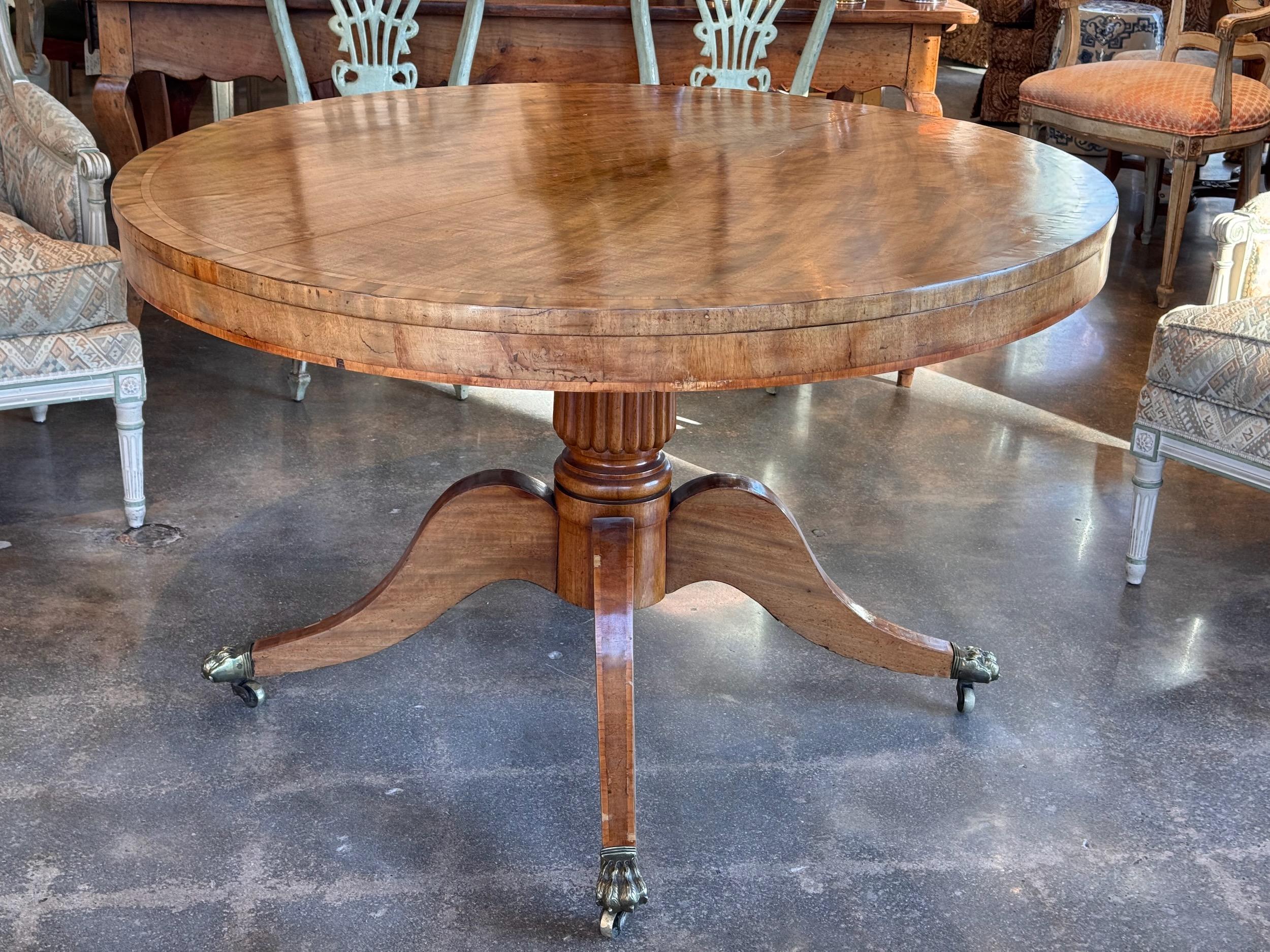 A beautiful faded mahogany center table. Perfect small dining table.
