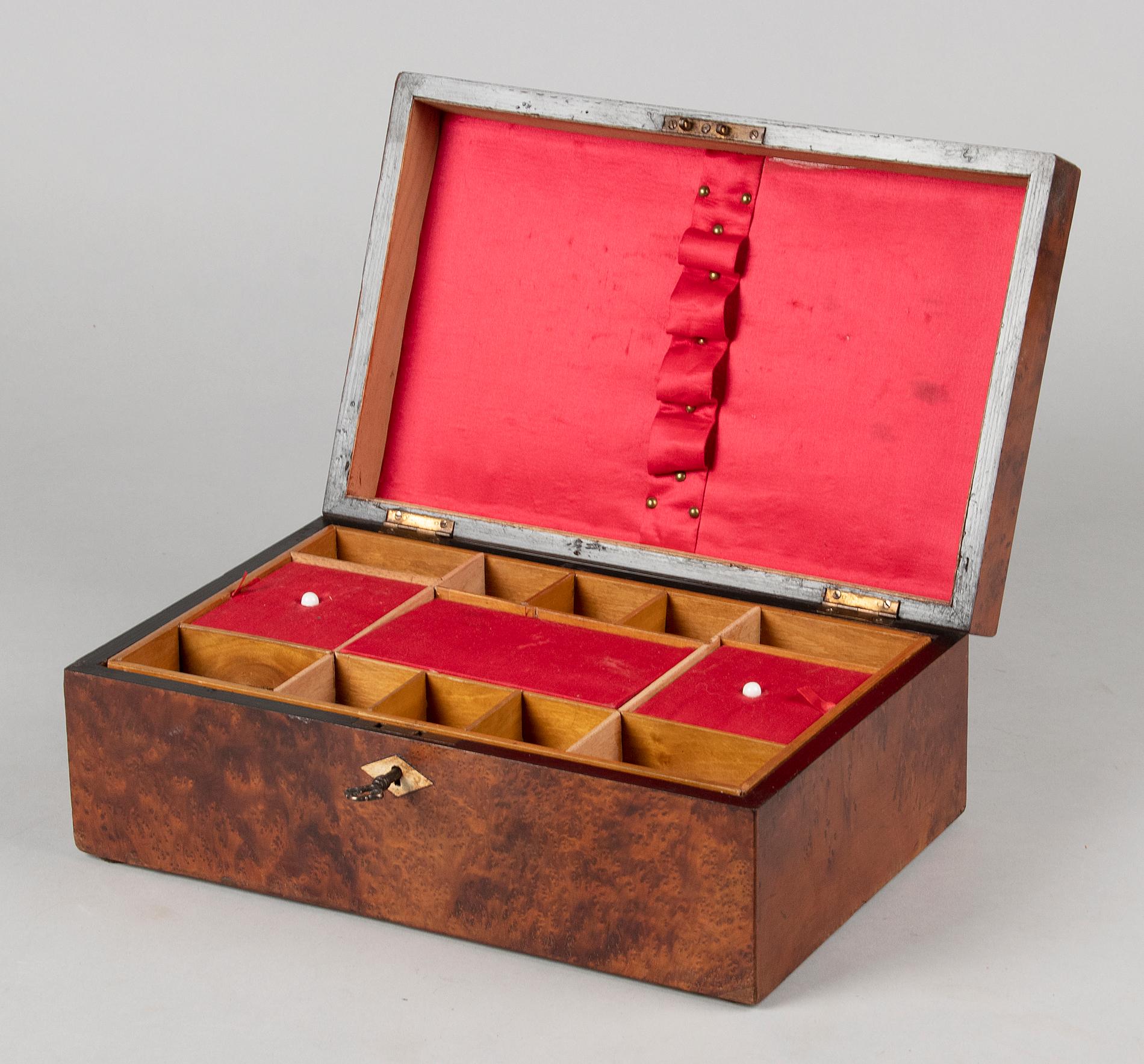 Beautiful antique chest from England. The box is made of softwood, veneered with burr walnut and inlaid with small pieces of mother-of-pearl. The interior has several compartments and a removable tray. Parts are covered with red fabric, original