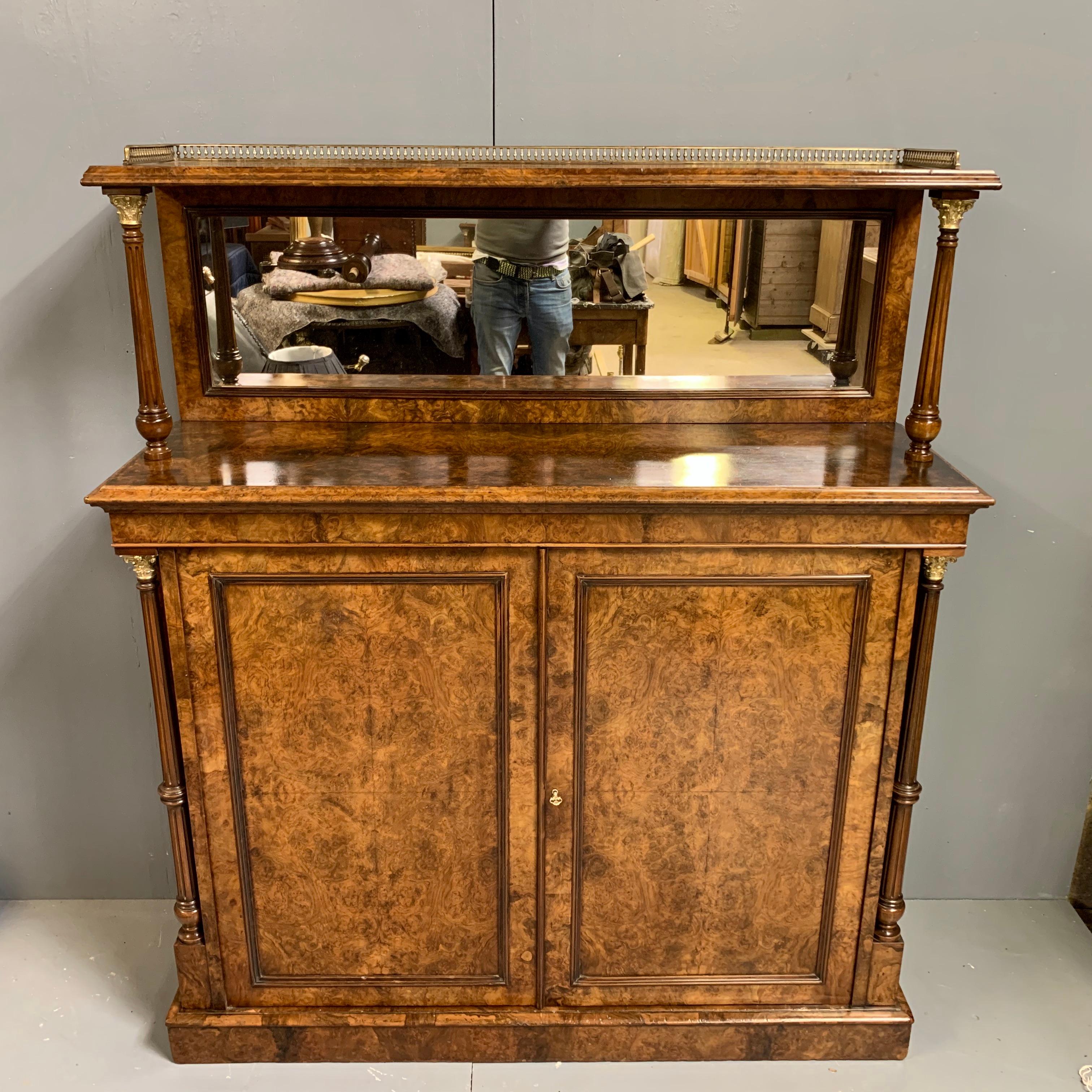 This is an extremely fine quality English 19th century burr walnut two door cabinet with its original mirror back and also a 3/4 gallery to the top rail.
Beautifully restored and the burr walnut colour tone is now as it was intended after years of