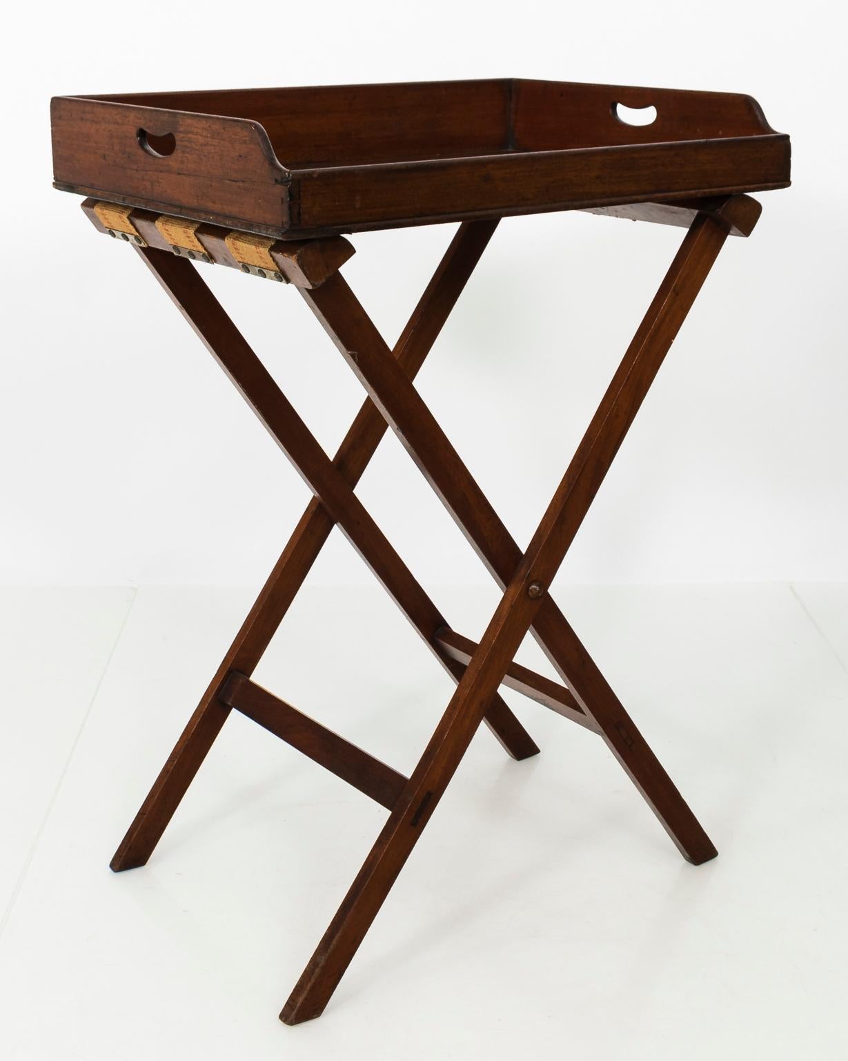 19th century English butler's tray table with gallery and a folding Stand base, circa 1840.
 