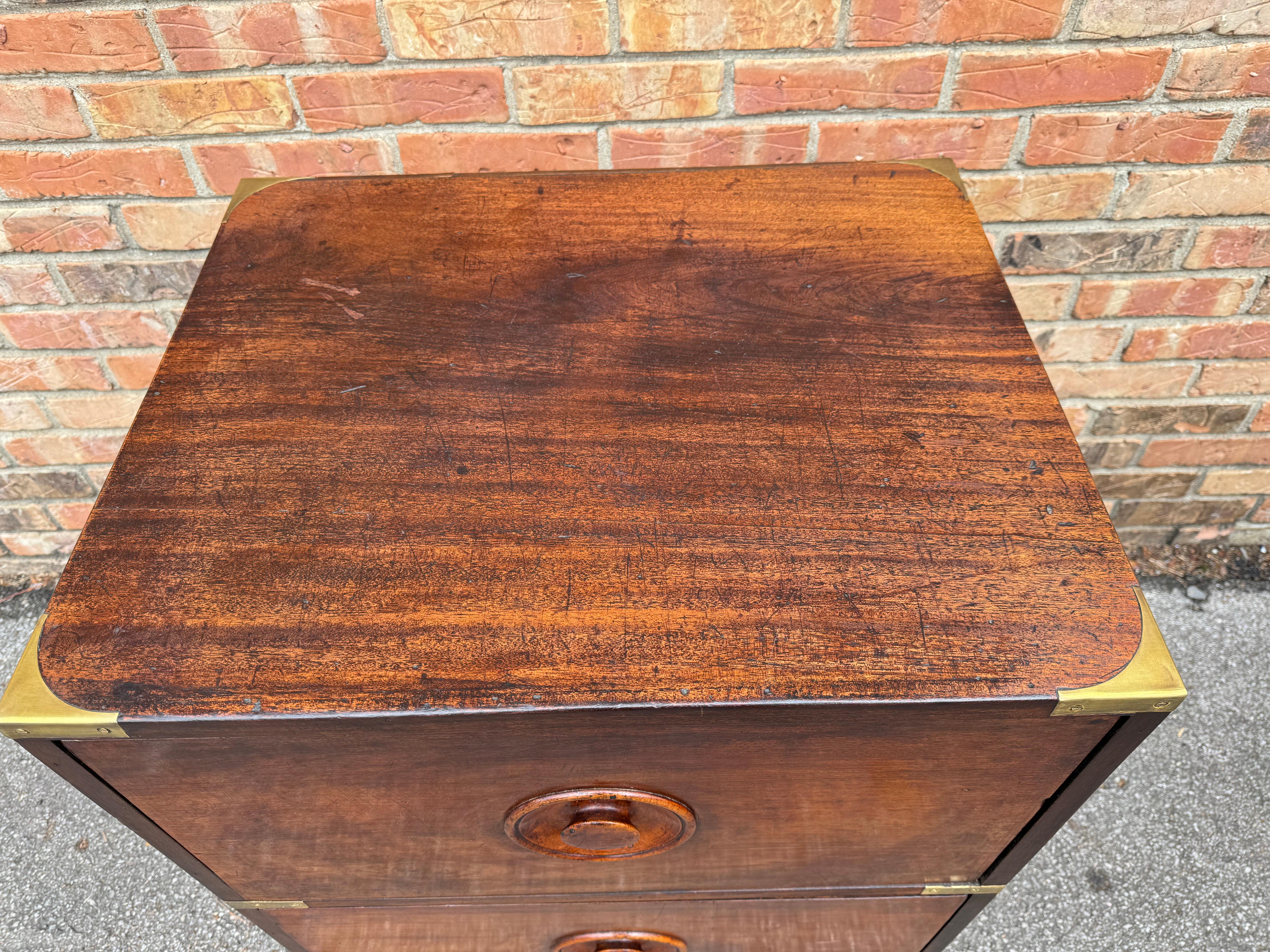 This is such an unusual English campaign chest or possibly nightstand. I've never seen a campaign style item in this particular size, not only that the beautiful round pulls on the front of the drawers are so unique. 

DIMENSIONS
24.5ʺW × 20ʺD × 30ʺH