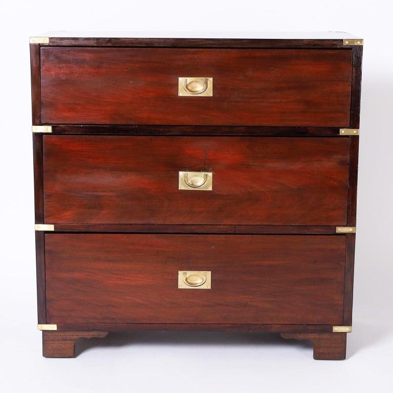 19th century English campaign chest with three drawers hand crafted in mahogany with oak secondary woods, cast brass hardware, and bracket feet.