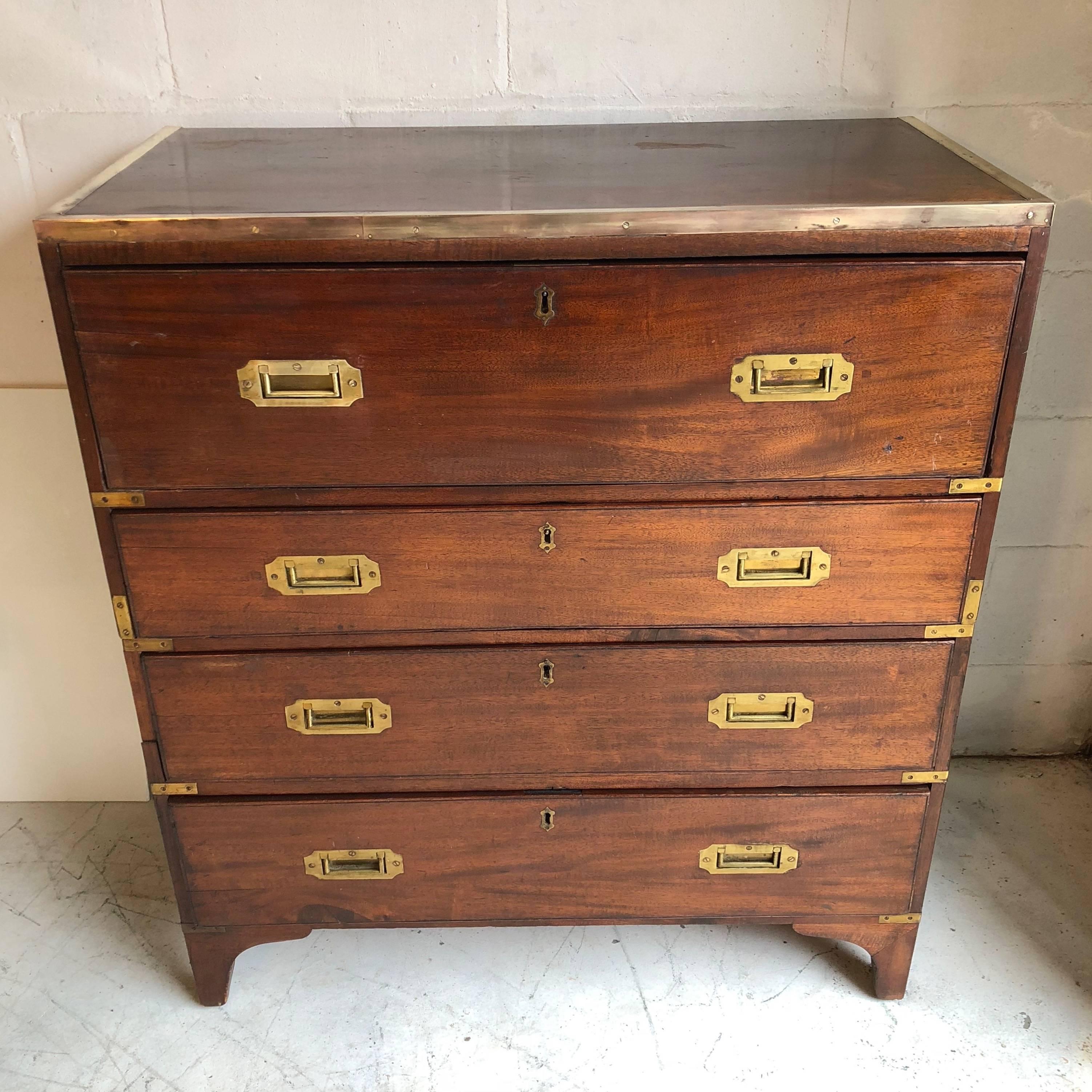 19th century English two-part Campaign chest having a desk in its top drawer.