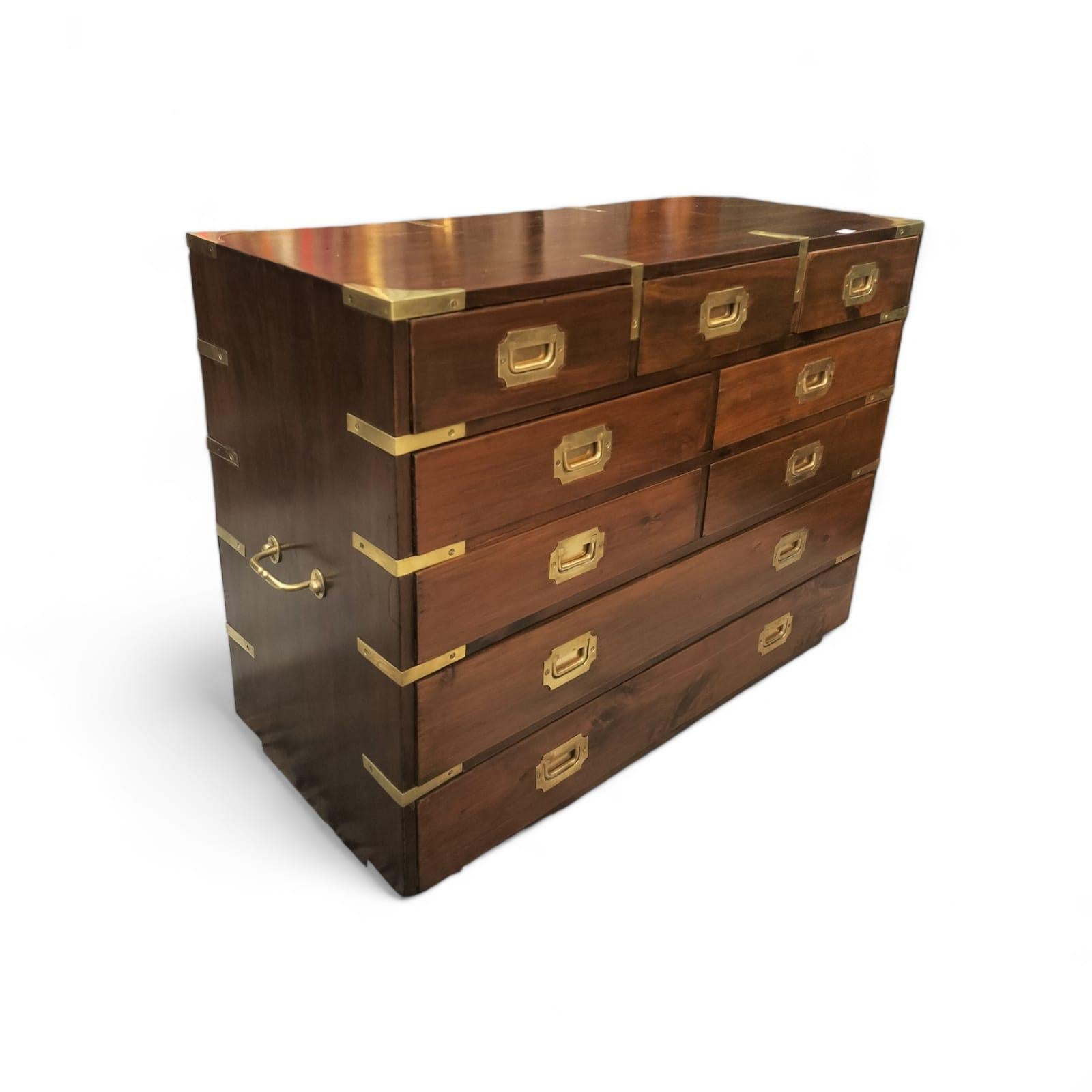 This stunning mahogany chest of drawers model was originally used by the British navy. It features charming typical campaign handles as well two carrying handles on both its sides. 

The size of this piece, measuring 66 cm in width and 49.3 cm in