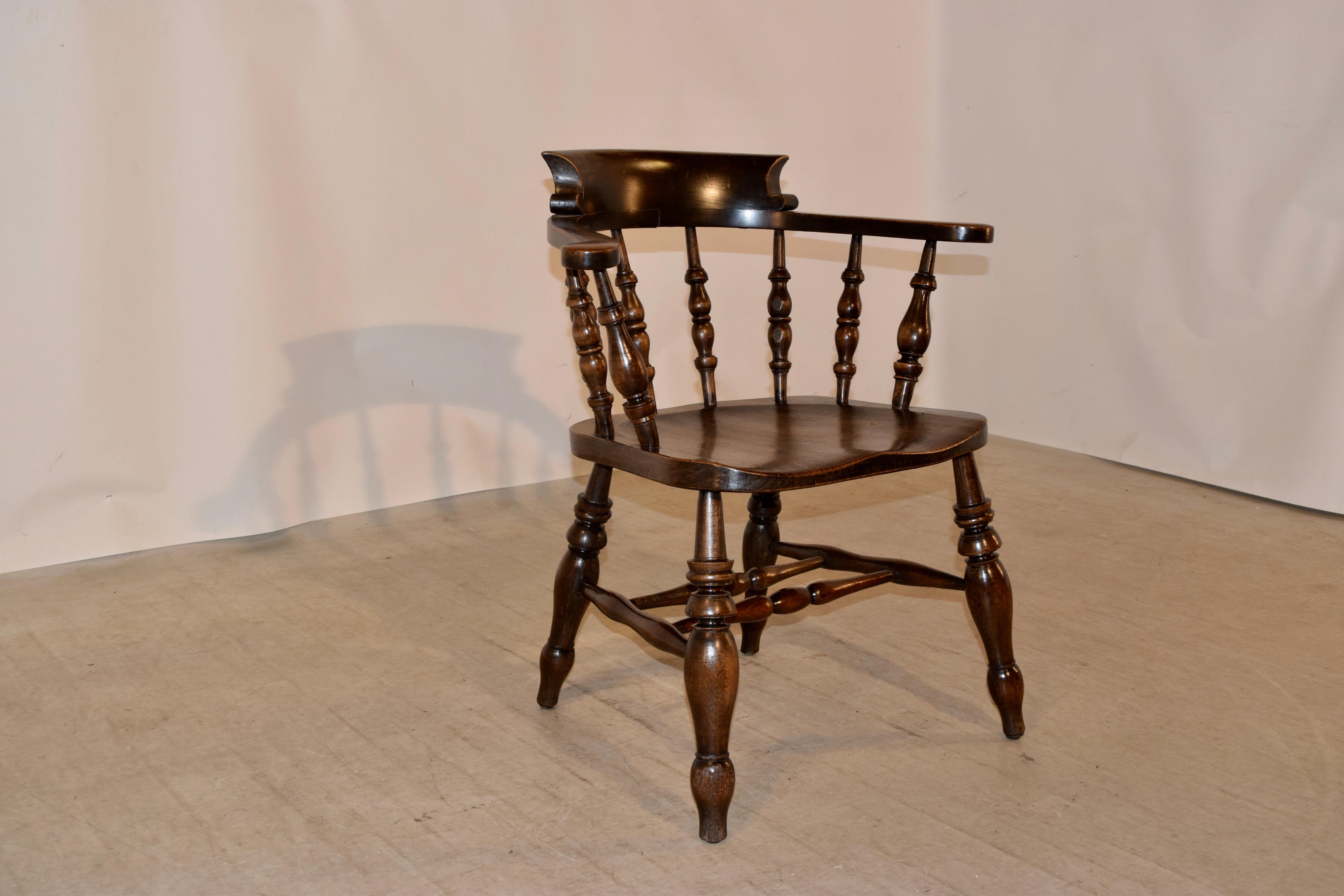 19th century English captain's chair made from oak with lovely hand turned spindles and legs, joined by hand turned stretchers. The seat is made from elm, and has been hand shaped for comfort. The seat measures 19.5 x 19.75 x 18 high.