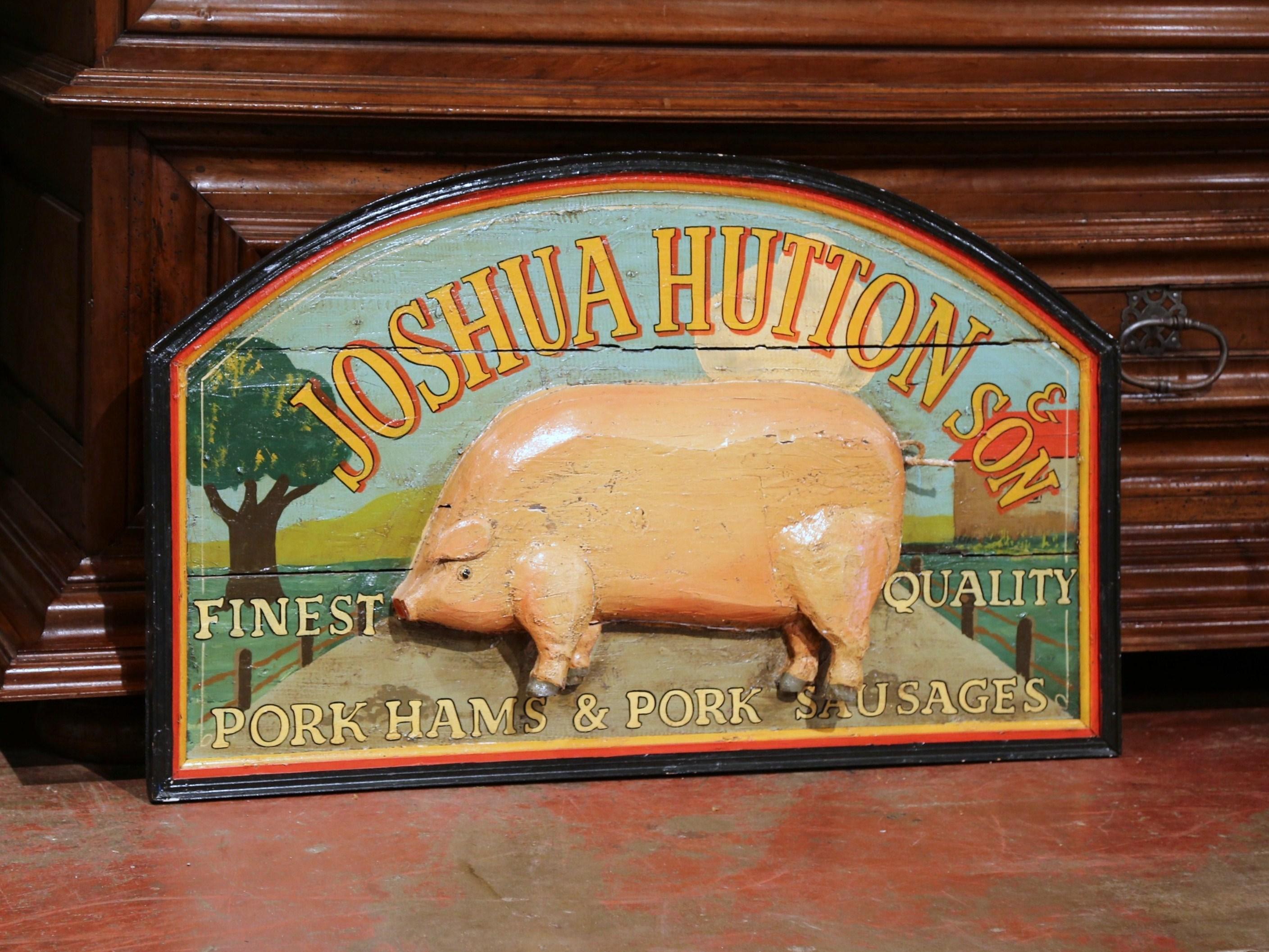 Add charm and color to your kitchen with this antique arched butcher sign. Crafted in England, circa 1880, the colorful, hand-painted, wall hanging piece features a carved pig figure in the centre with trees and a pasture scene in the background.