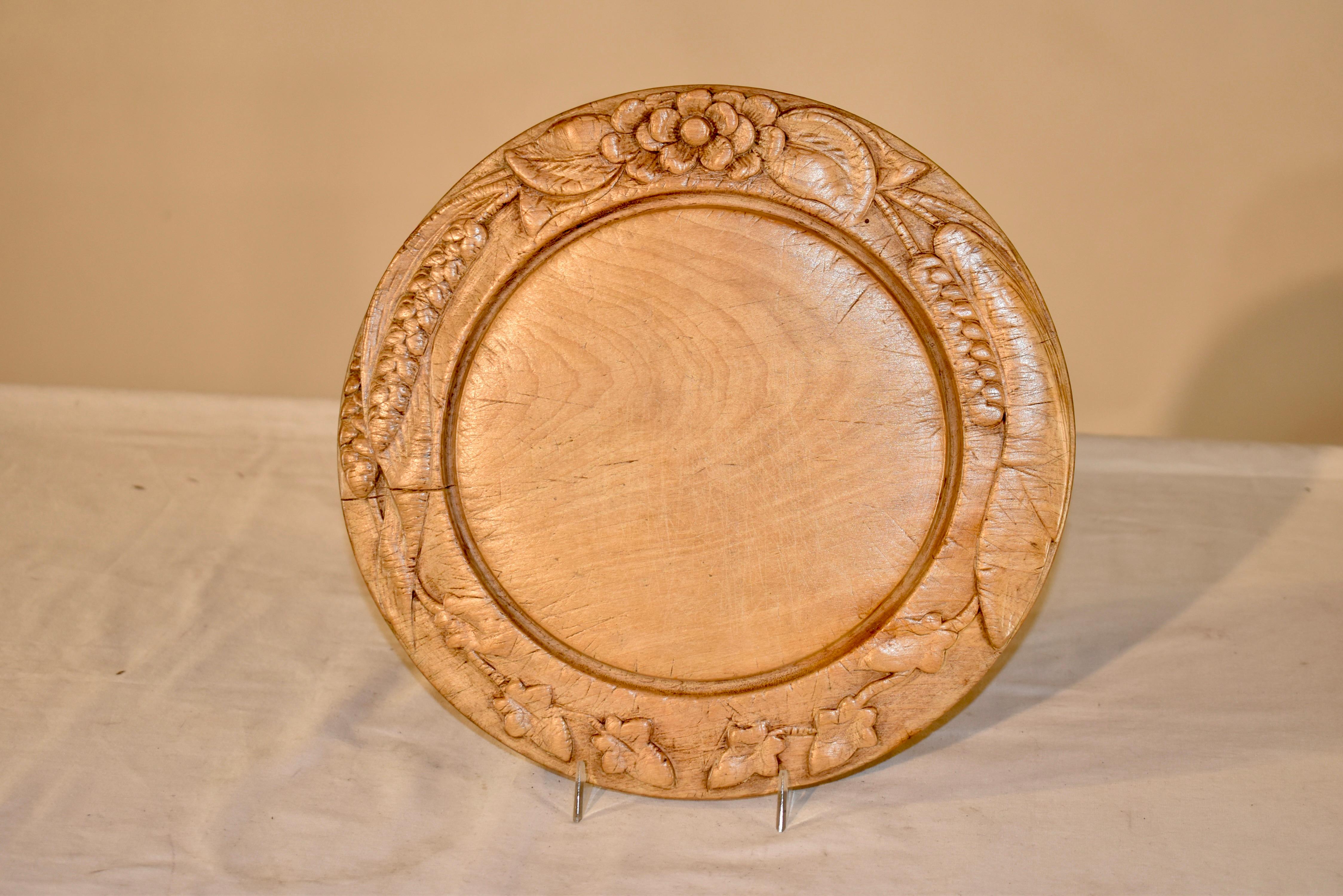 19th century English bread board made from sycamore.  The border is hand carved with florals and wheat.  Nice and deep carving.