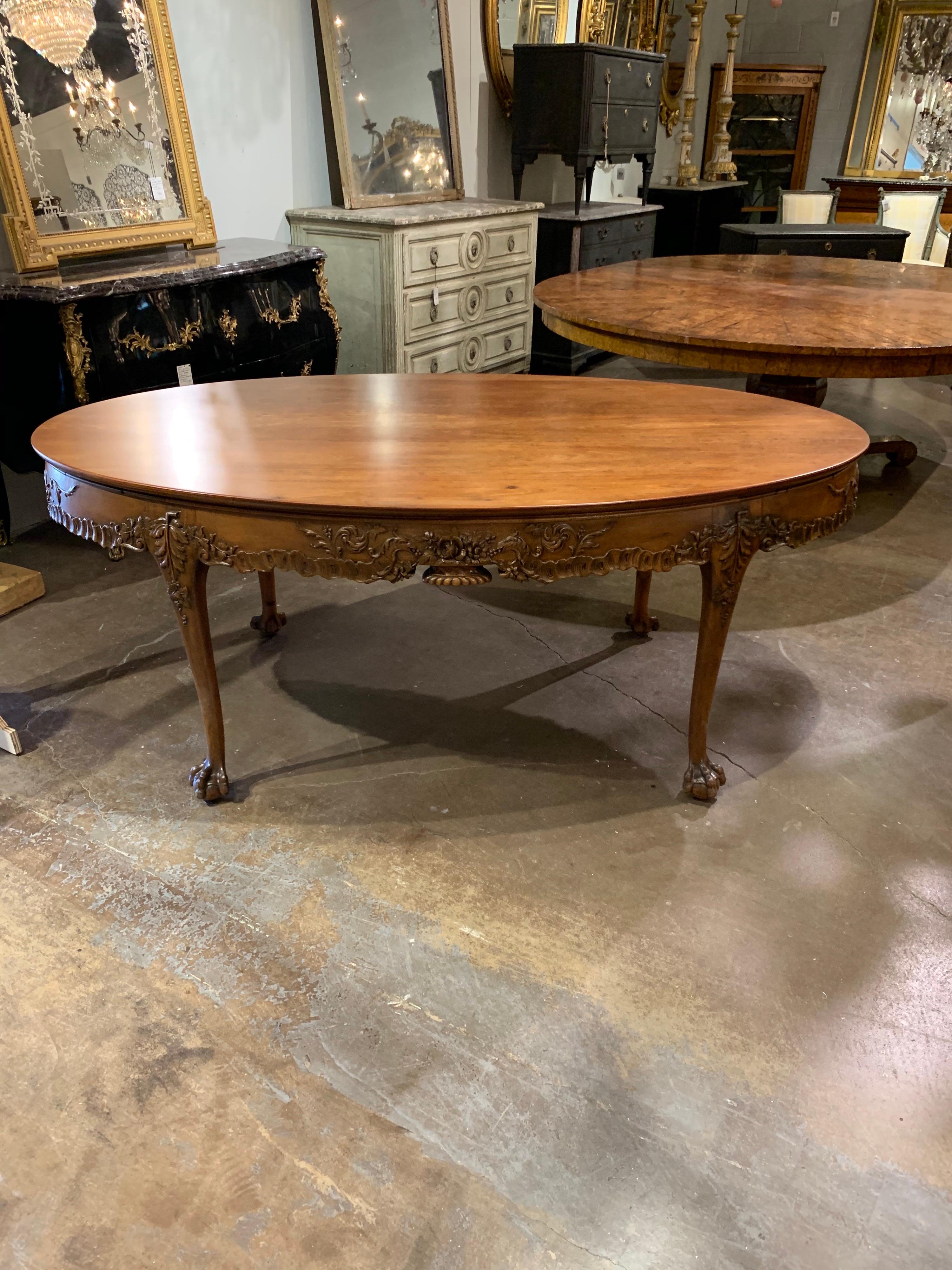 Gorgeous 19th century English carved mahogany oval breakfast table. The carvings on this table are superb. Beautiful finish as well. An outstanding piece!