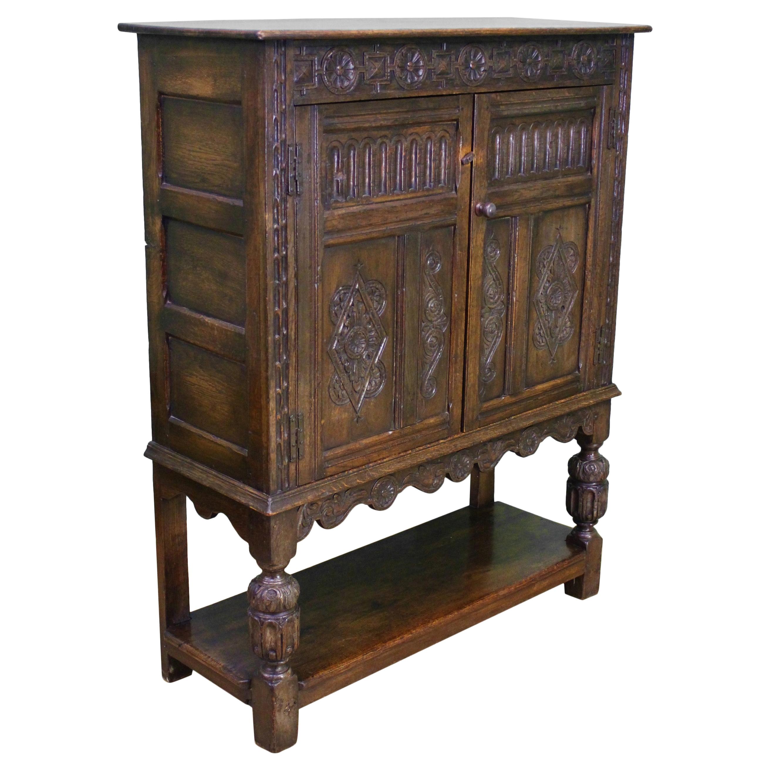 19th Century English Carved Oak Cupboard For Sale