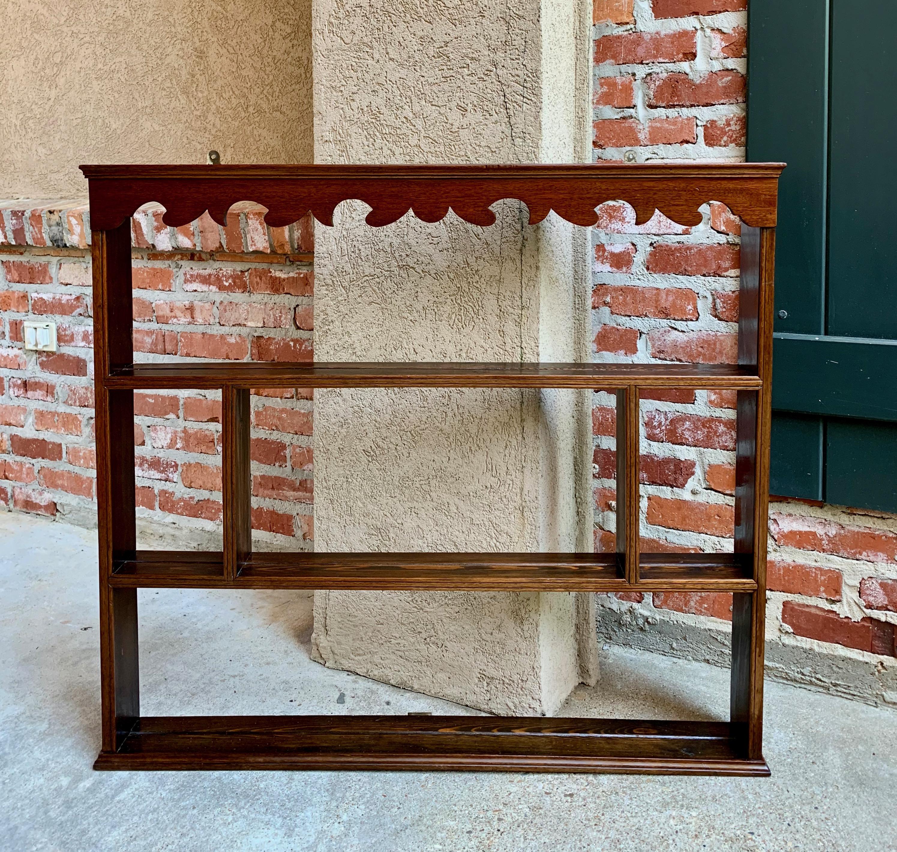 Direct from England, a true antique English plate rack in a versatile size, with plenty of different size display shelves!~
~Large scalloped upper crown (looks like mahogany) sets the Classic look~
~Fronts of all shelves are finished with dual
