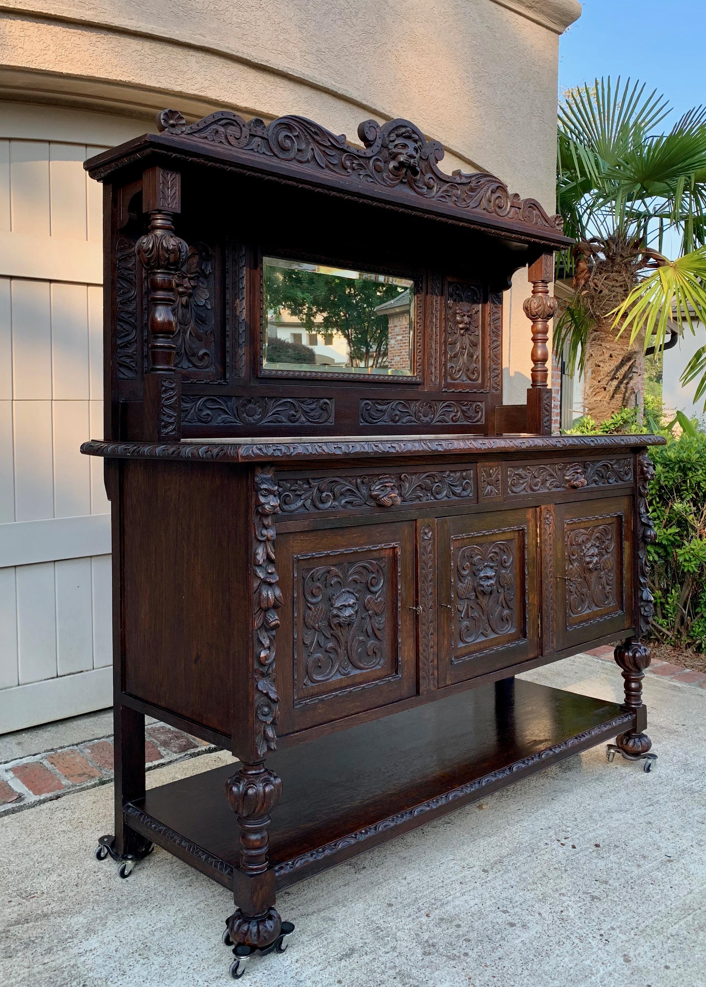Direct from England, a stunning antique English carved oak sideboard cabinet, over 6 ft. tall and 5.5 ft. length, it will certainly be a statement piece in any room!~
~Hand carved details throughout, with a big serpentine crown having a center
