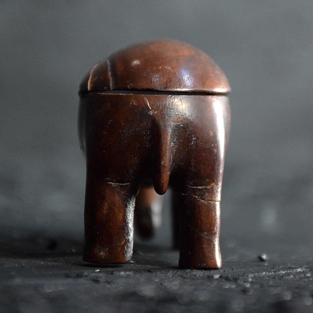 19th century Elephant vesta 
A charming example of and English 19th century treen carved wooden vesta, in the form of a elephant. In untouched condition this object opens to reveal a small matchstick compartment and its original match strike. Brass