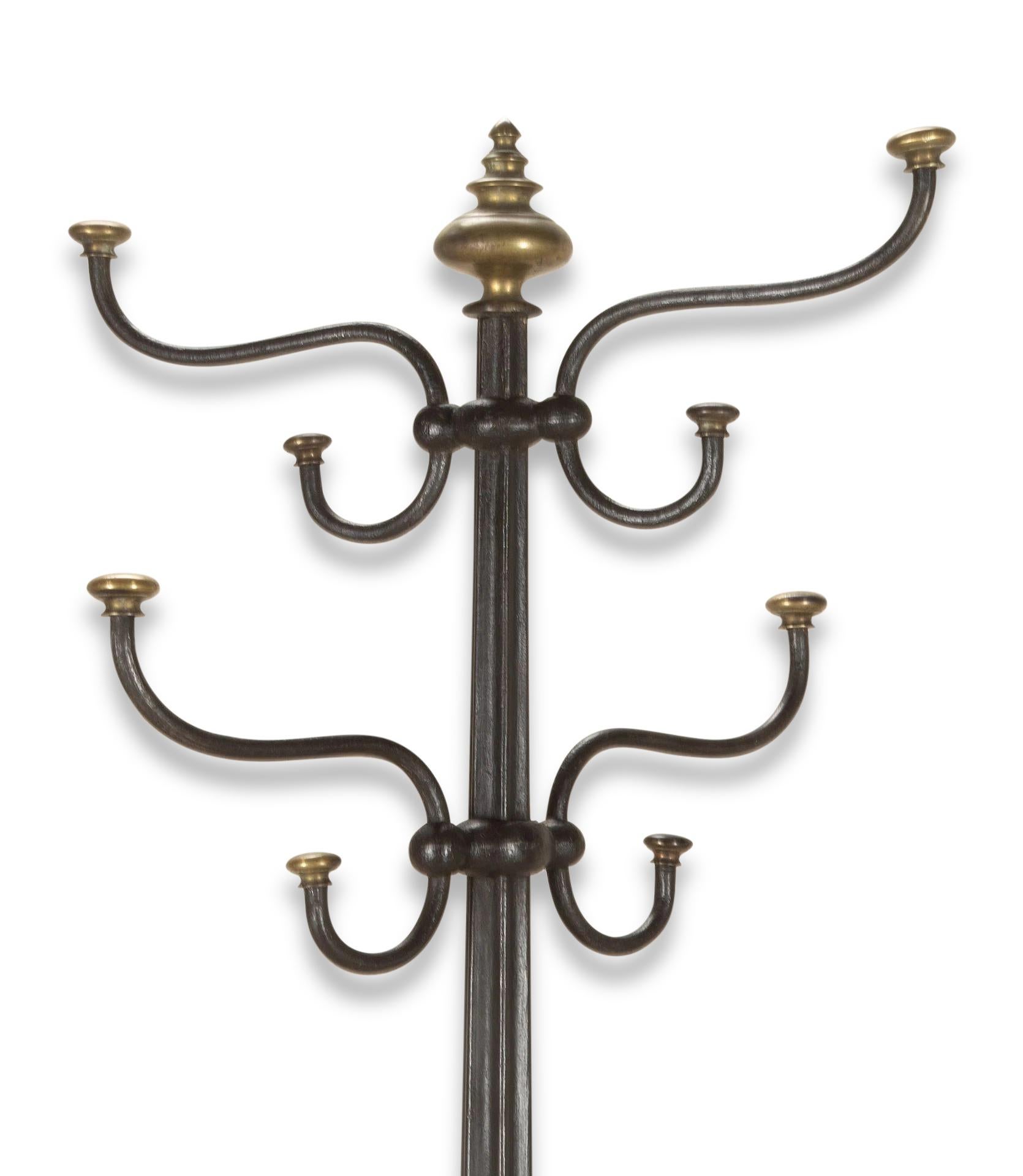 Early 19th Century English hat and coat hall stand.

This hall stand is unusual as it is made in crisply cast cast iron which features a central reeded column with sixteen ornately-shaped hooks at the top and a turned brass finial. Also