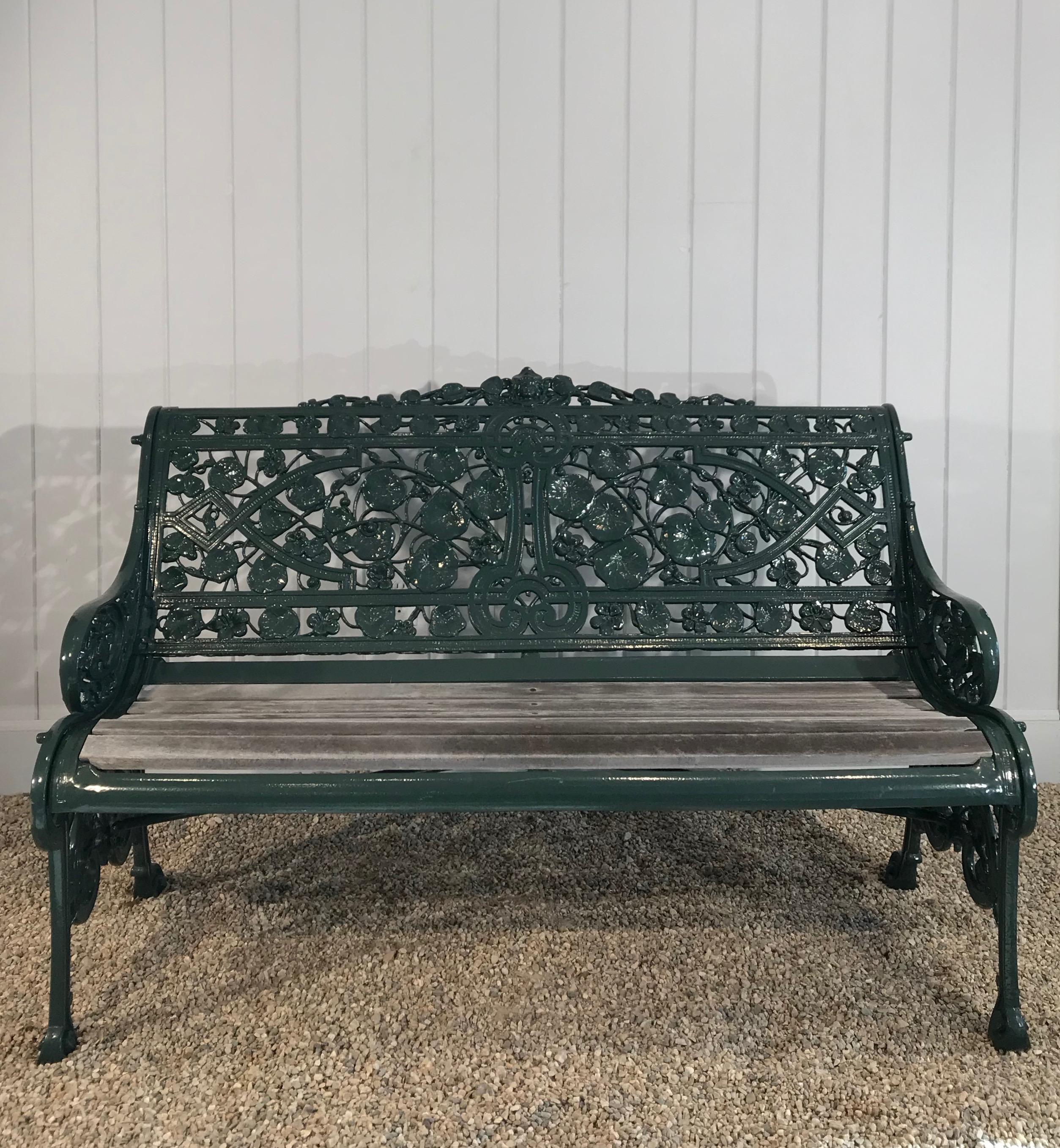It is rare indeed to find an authentic Coalbrookdale Nasturtium bench in such wonderful condition. This beauty has been sandblasted, powder-coated in a dark glossy green surface and the slats have been replaced in the past 5 years. The depth of
