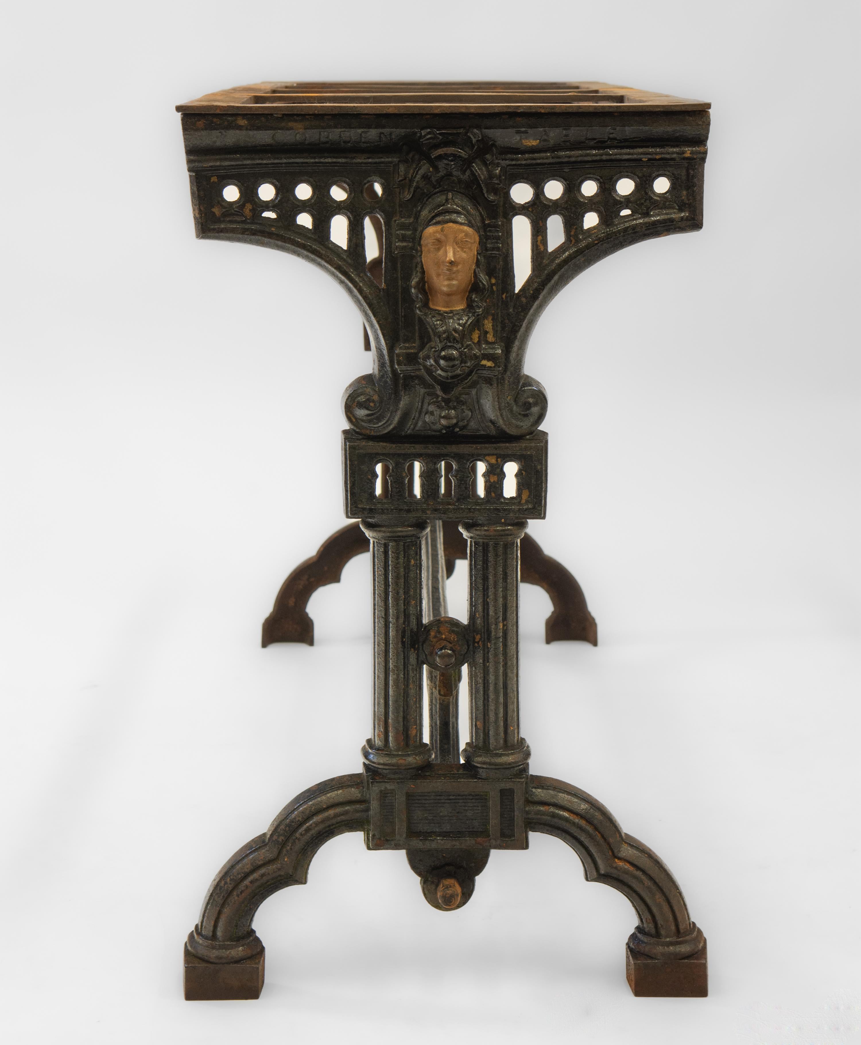 19th century cast iron garden/conservatory rectangular table base. English, circa 1870. Stamped 'Cobden Table' along with a patent number. 

A very well cast table base, depicting Britannia on each end between scrolls, with keyhole piercings below.