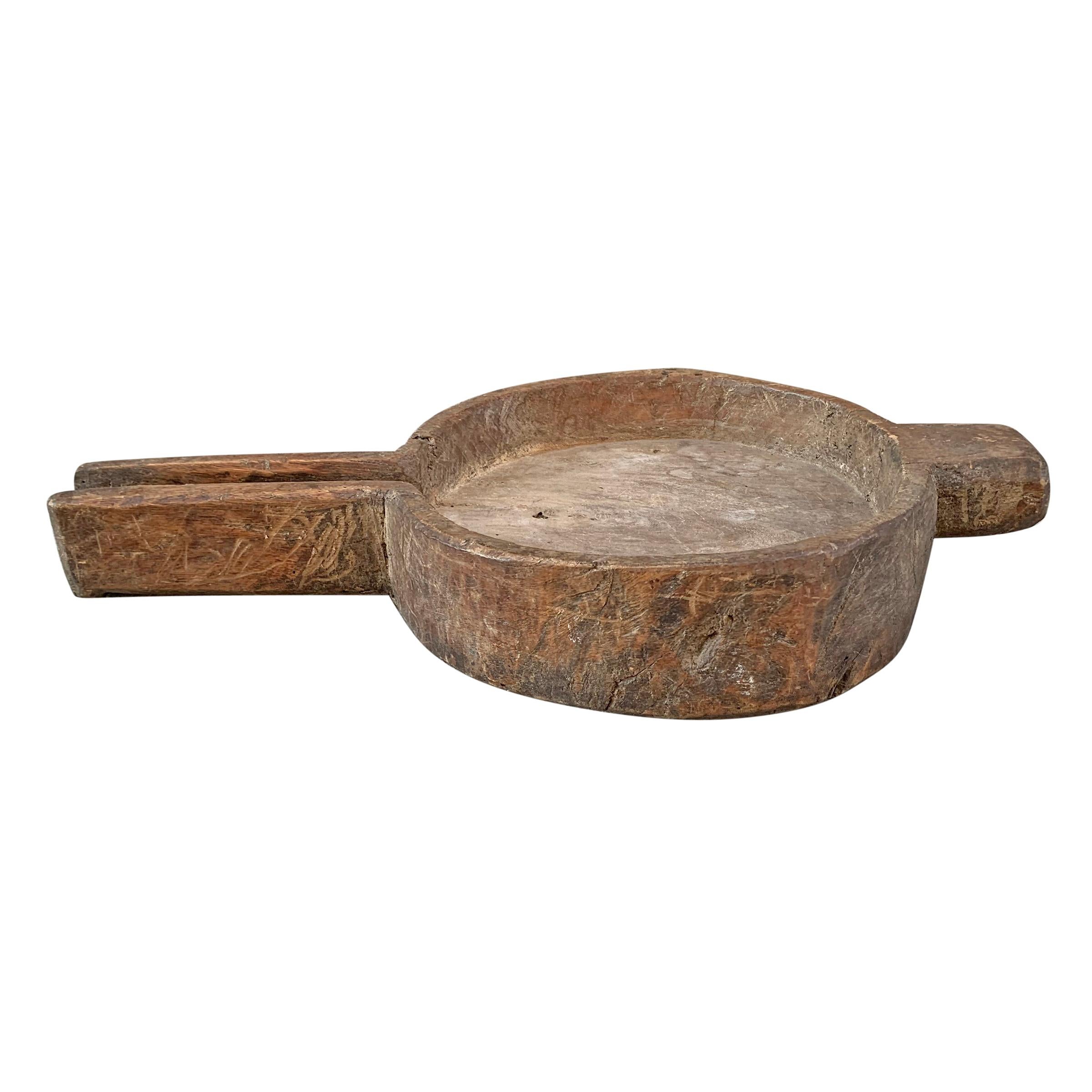 A fantastic 19th century English cheese press carved of one piece of wood with a wonderful patina and a spout on one end to allow the whey to drain out. Perfect as a vessel on your kitchen counter to hold fruit, or for use as a cheese and