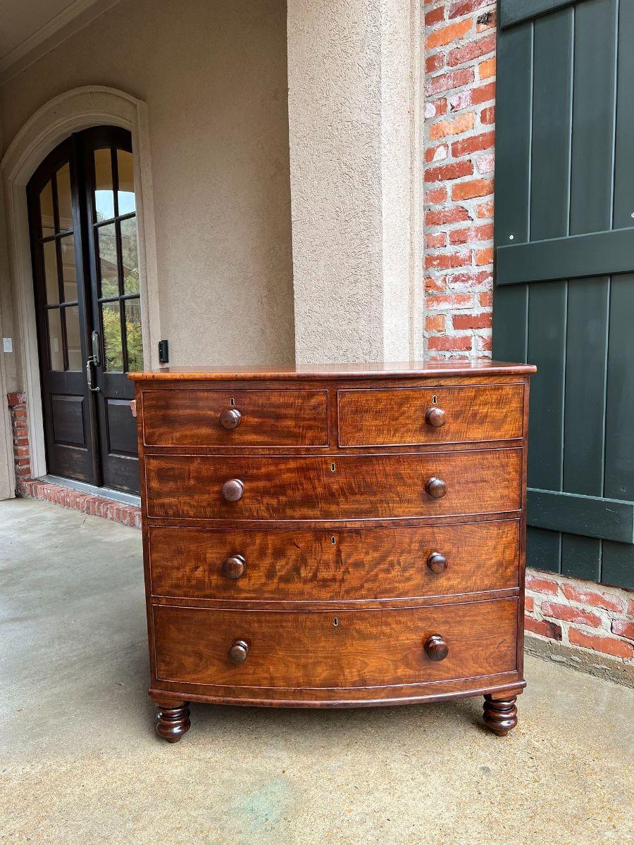19th Century English chest of drawers bow front mahogany Victorian dresser.

 Direct from England, a superb 19th century chest of drawers. Classic British style in the silhouette of the bow front and traditional form with two drawers over three