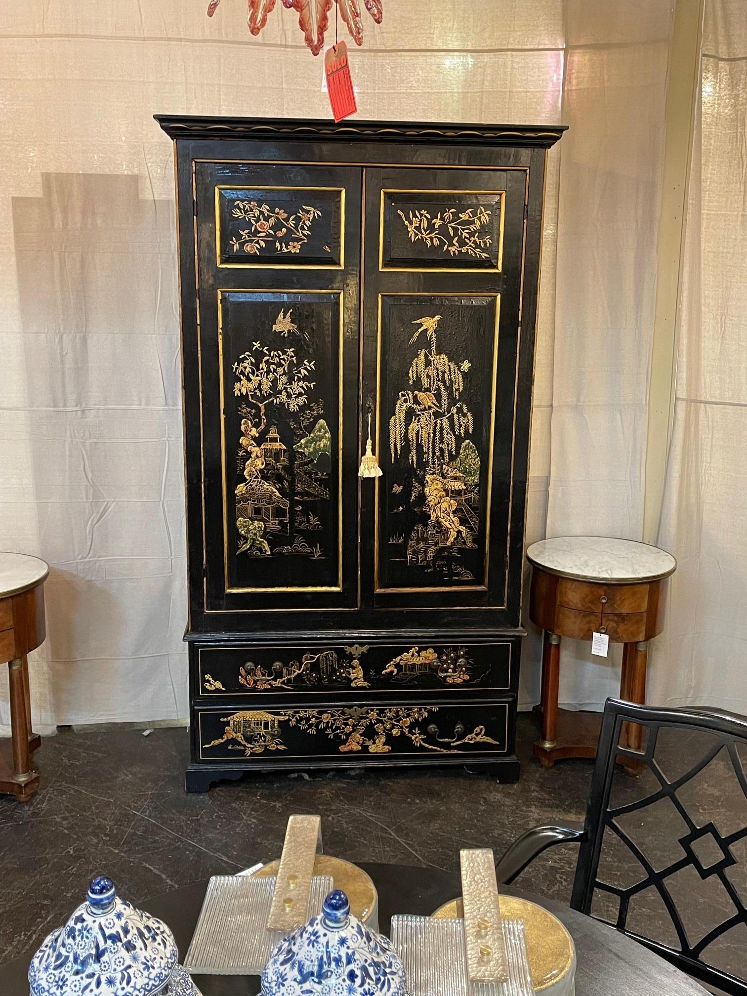 19th century English black lacquered chinoiserie cabinet. Circa 1850. This beautiful piece is sure to make a statement.