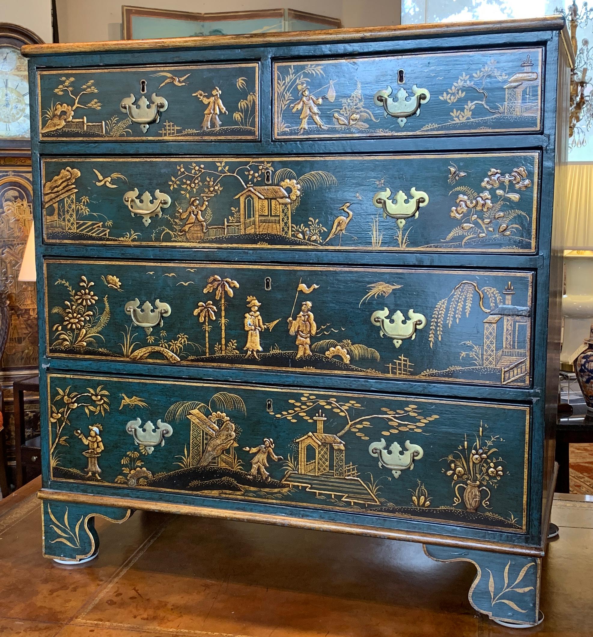 An unusual early 19th century English blue chinoiserie decorated chest of drawers having two small upper drawers above three graduated drawers resting on bracket feet. The chinoiserie decoration is extensive throughout the piece and is of very good